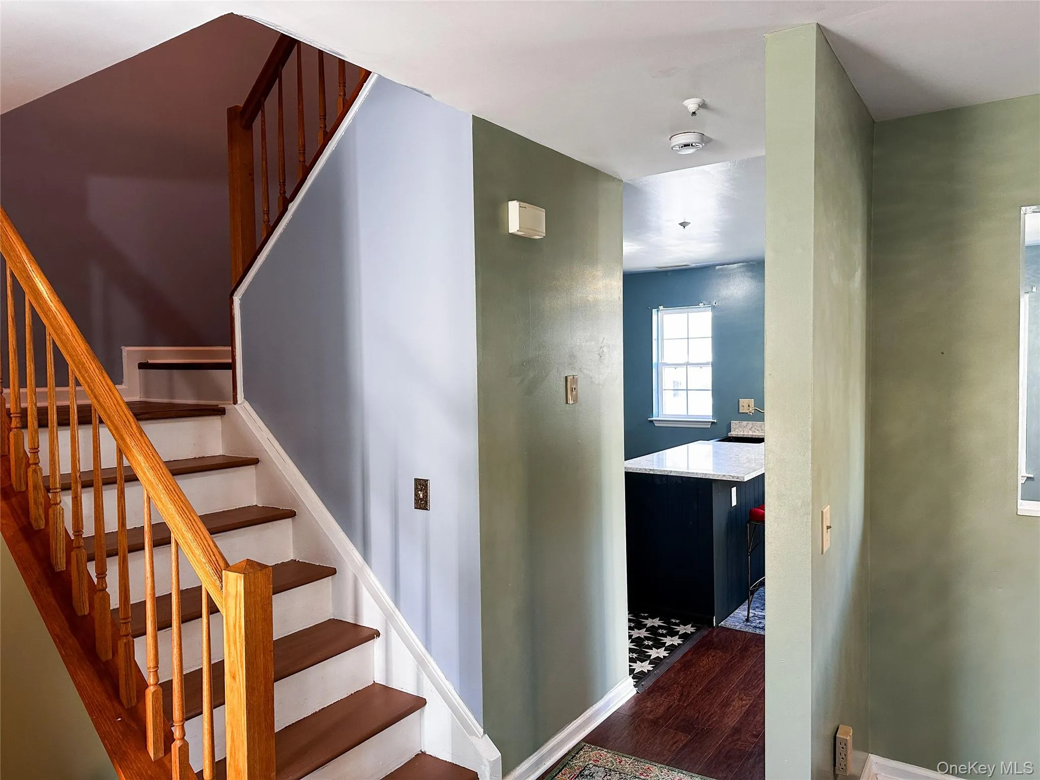 Staircase with wood finished floors and baseboards Staircase with wood finished floors and baseboards