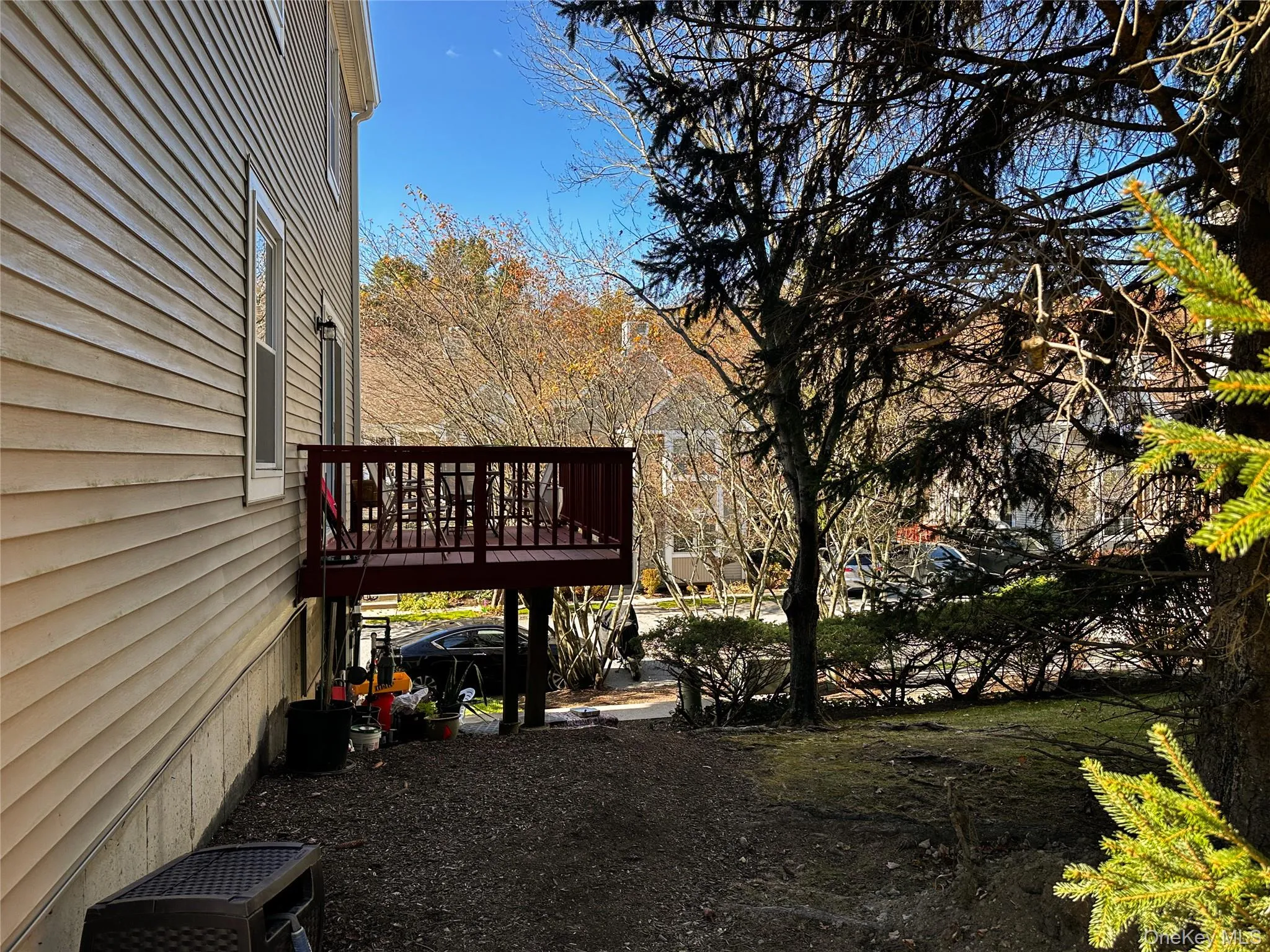 View of yard with a wooden deck View of yard with a wooden deck