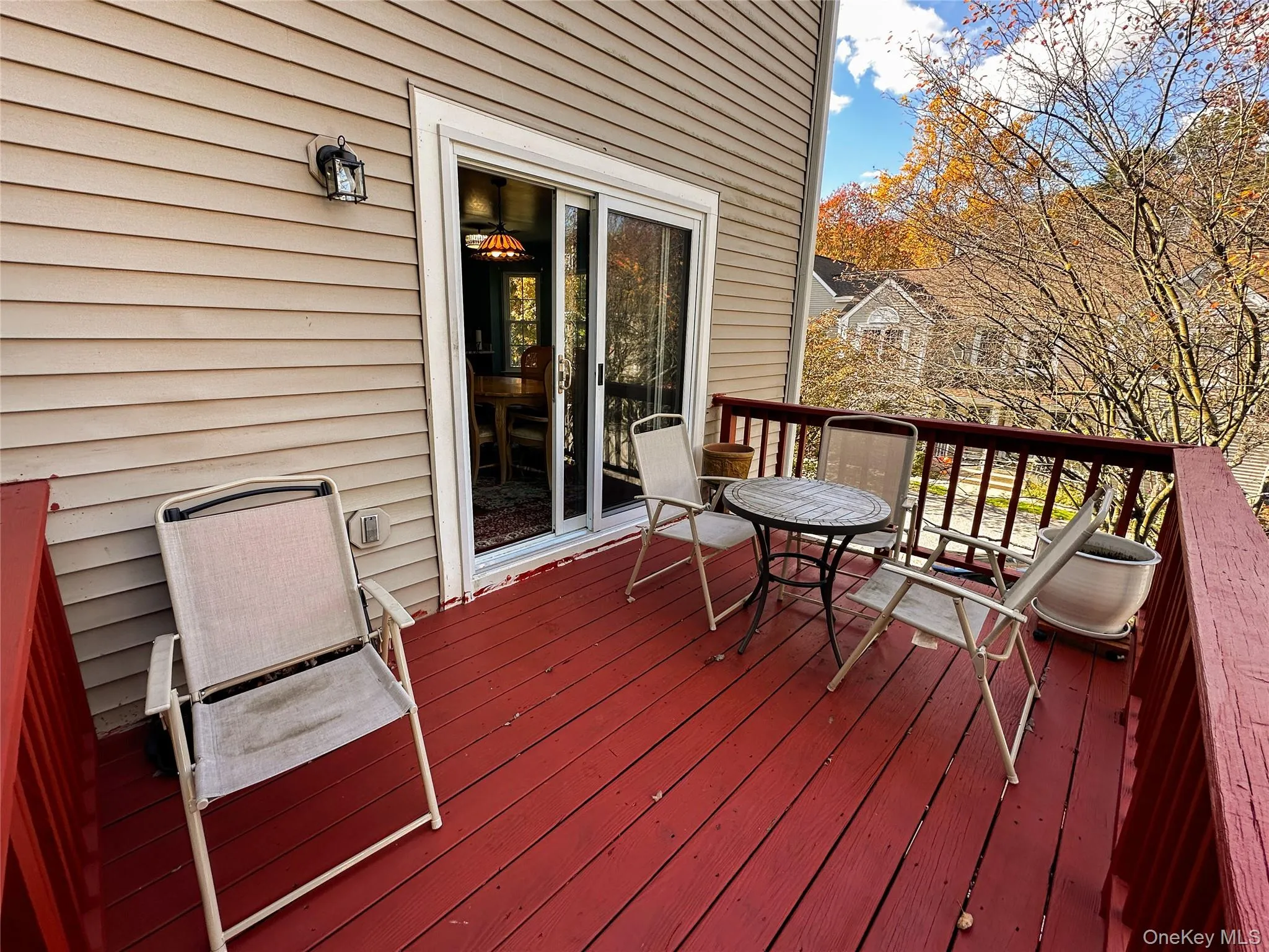 Wooden deck featuring outdoor dining area Wooden deck featuring outdoor dining area