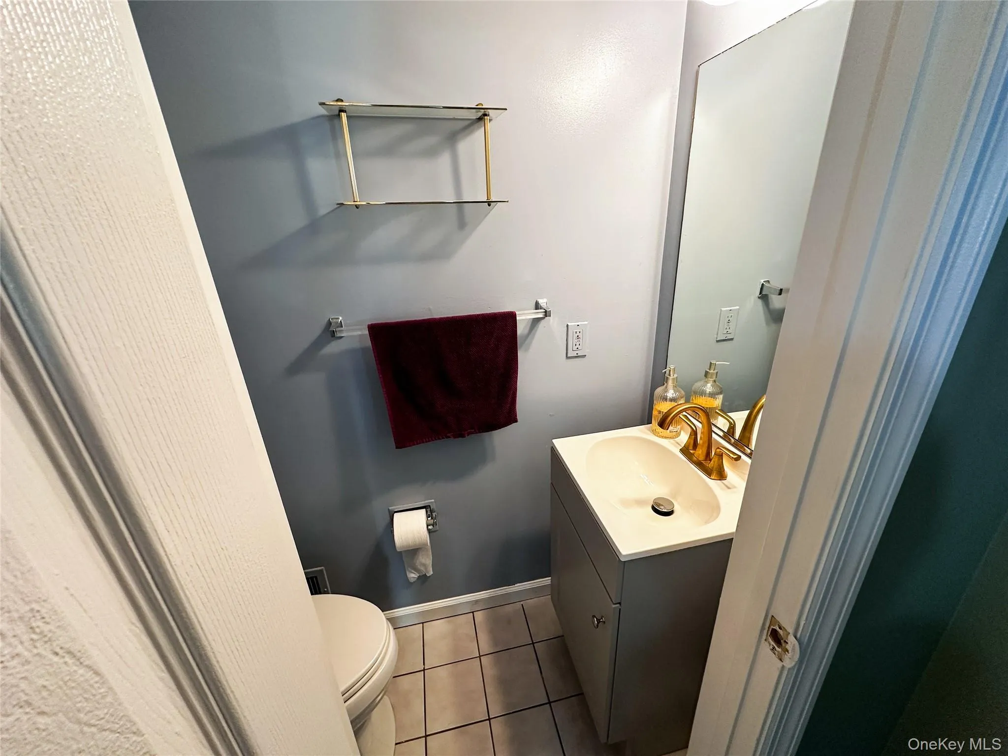 Bathroom with vanity and tile patterned floors Bathroom with vanity and tile patterned floors