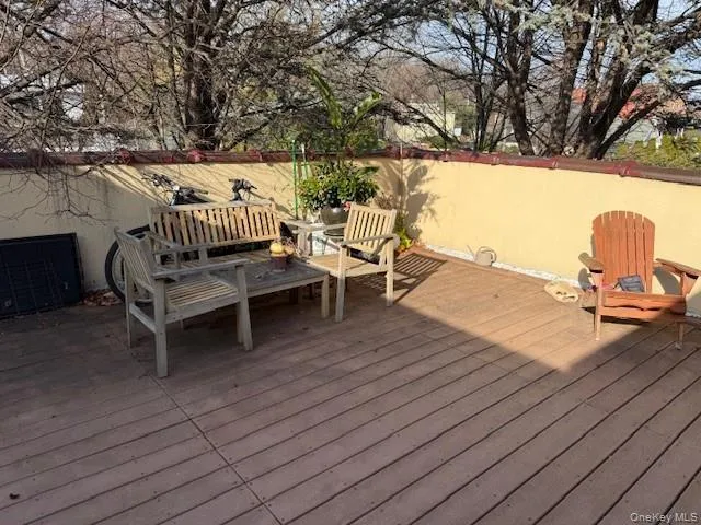 Wooden terrace featuring outdoor lounge area Wooden terrace featuring outdoor lounge area