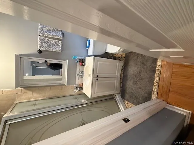 Full bath featuring vanity and a stall shower Full bath featuring vanity and a stall shower