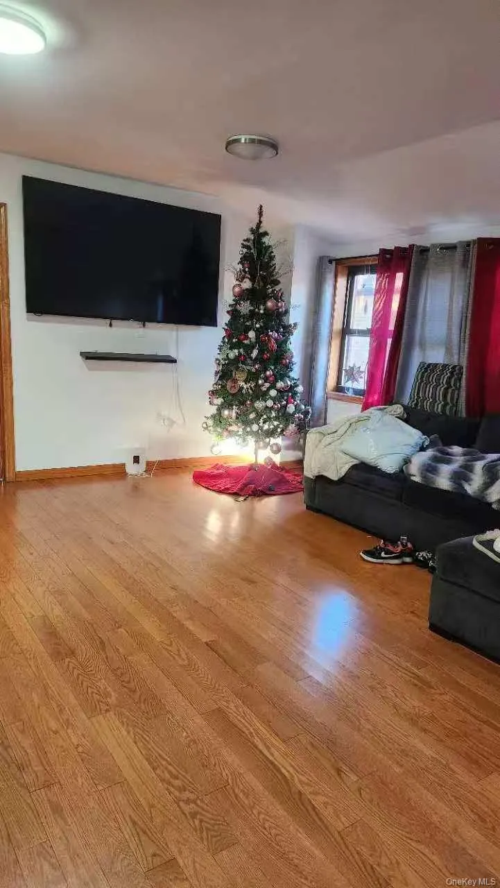 Living room with wood finished floors and baseboards Living room with wood finished floors and baseboards