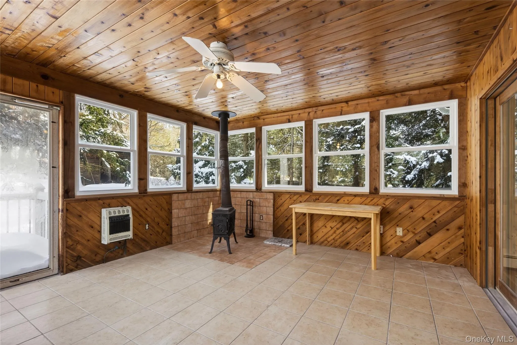 Cozy 3 season room with woodstove Cozy 3 season room with woodstove