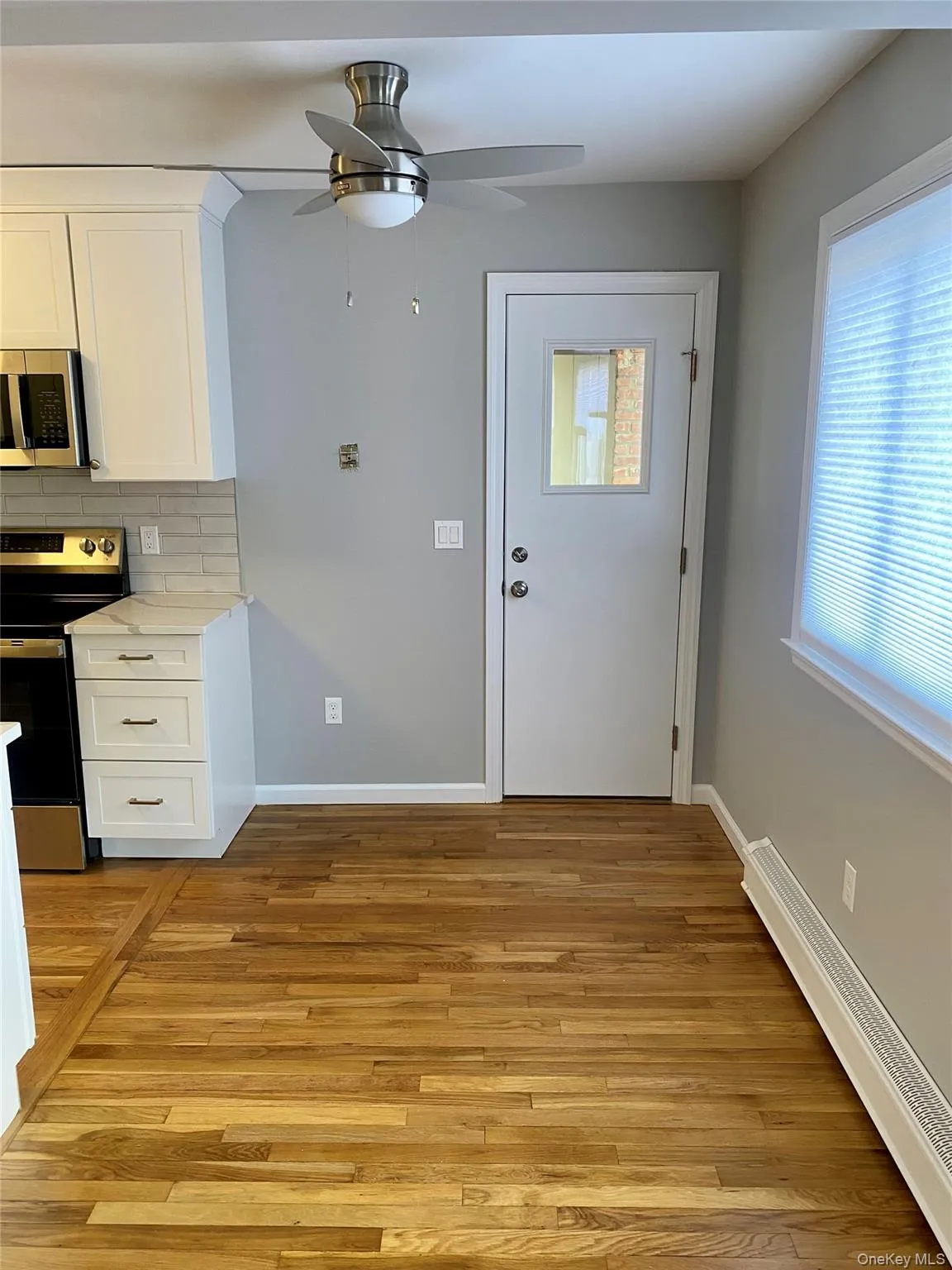 Dining area with door to patio. Dining area with door to patio.