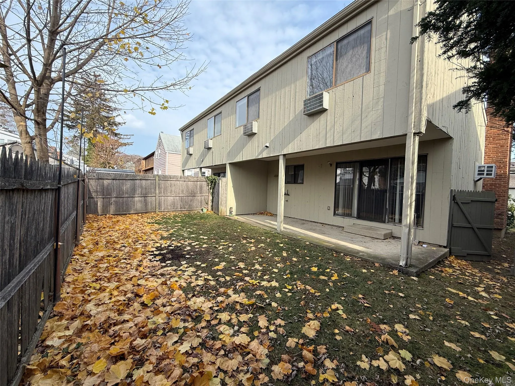 Back of house featuring a patio area and a fenced backyard Back of house featuring a patio area and a fenced backyard