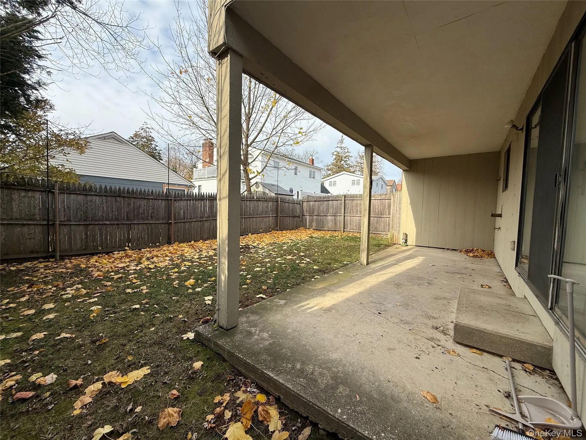 Fenced backyard with a patio Fenced backyard with a patio