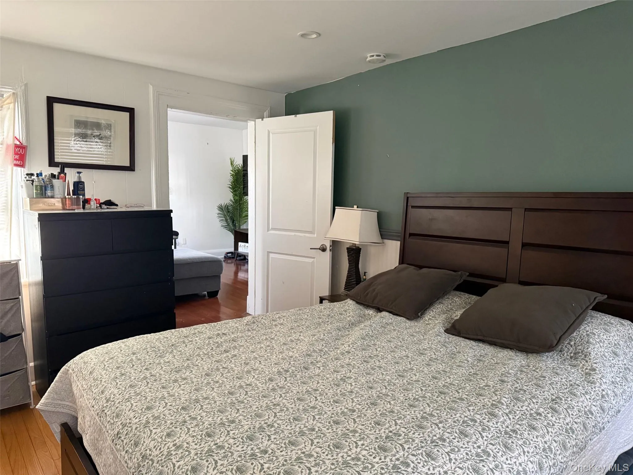 Bedroom with hardwood / wood-style flooring Bedroom with hardwood / wood-style flooring