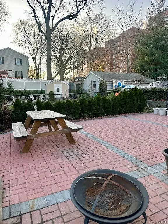 View of patio / terrace with a fire pit and outdoor dining space View of patio / terrace with a fire pit and outdoor dining space