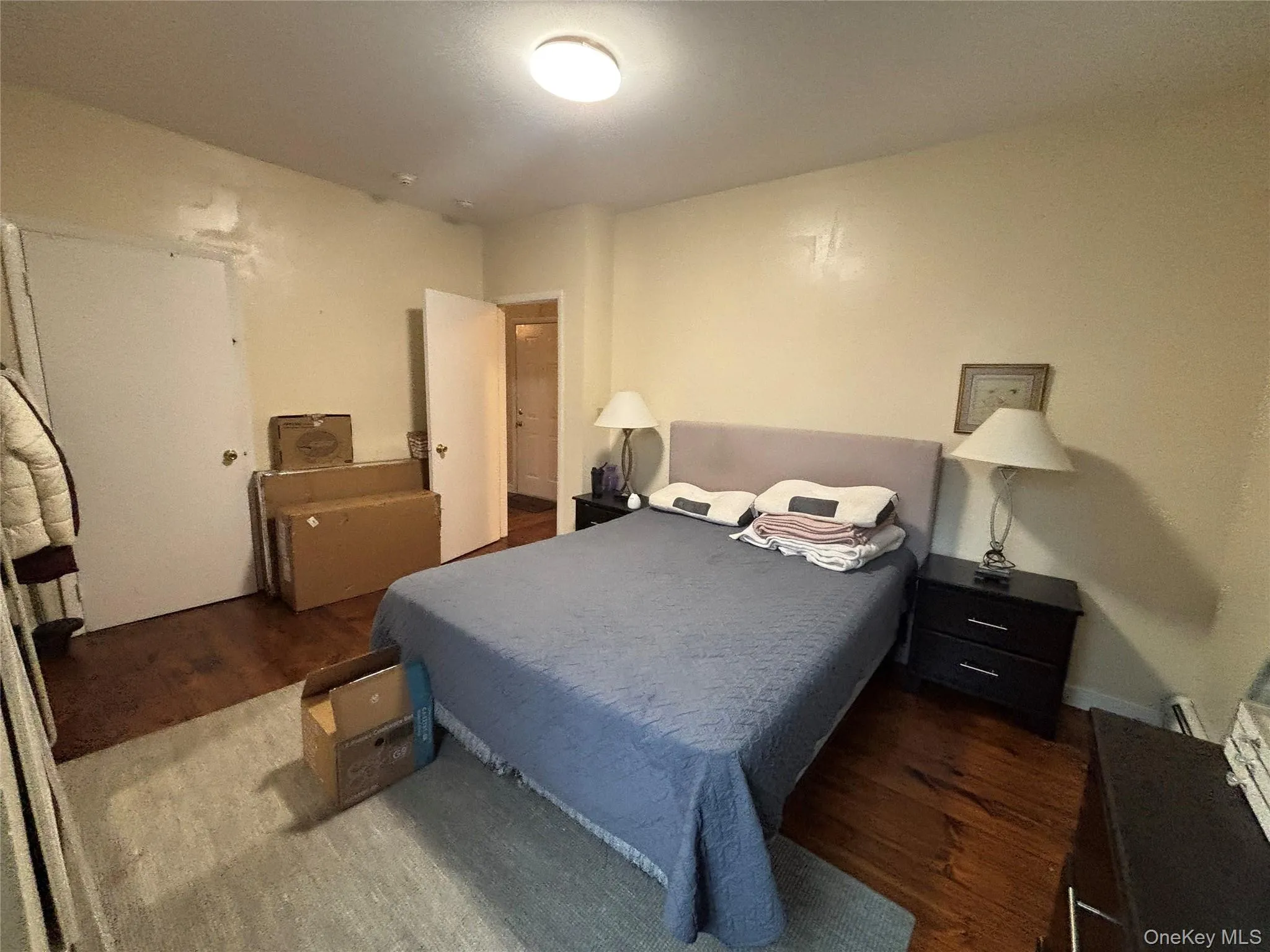 Bedroom featuring wood finished floors Bedroom featuring wood finished floors
