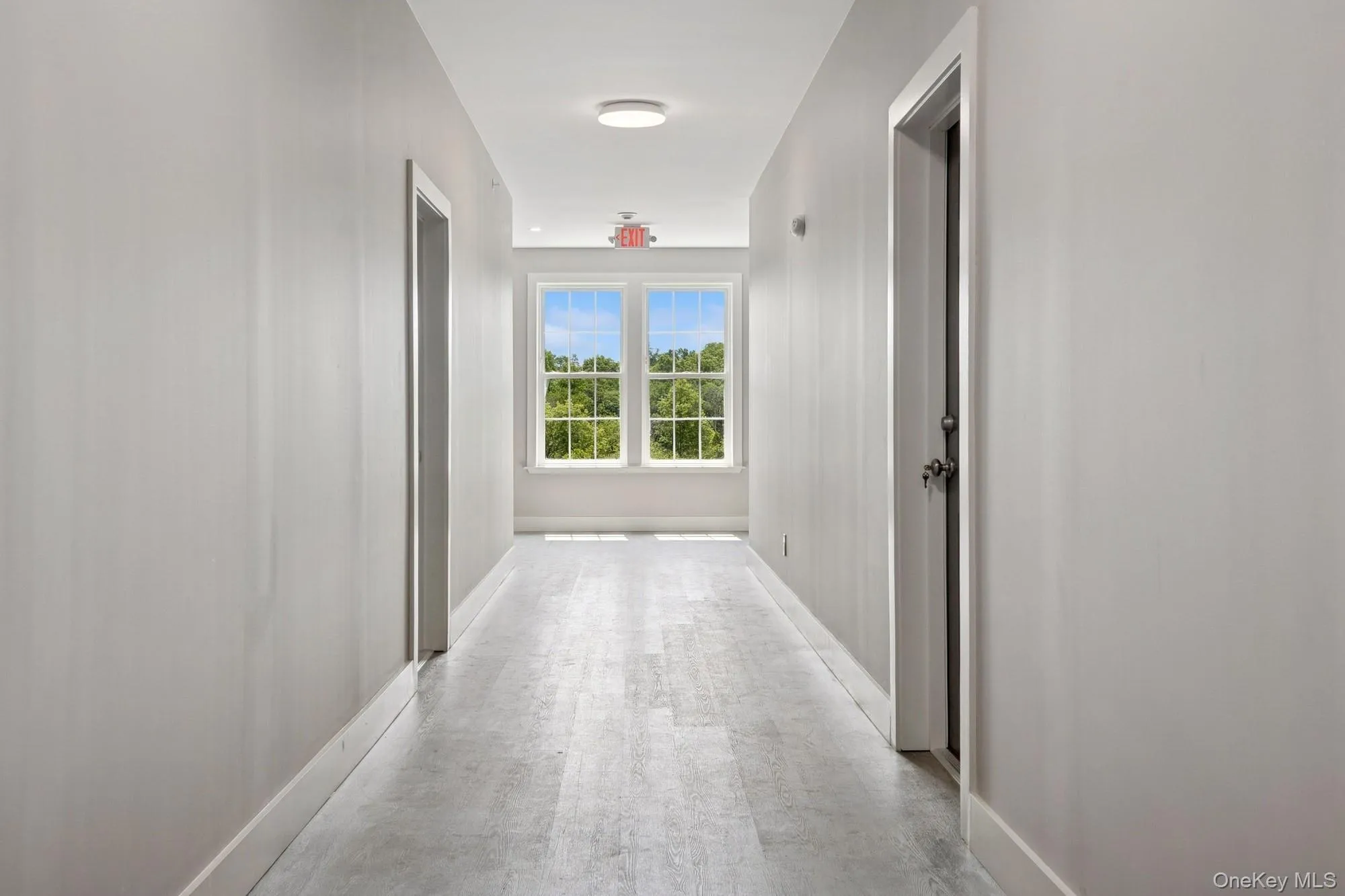 Hall featuring baseboards Hall featuring baseboards