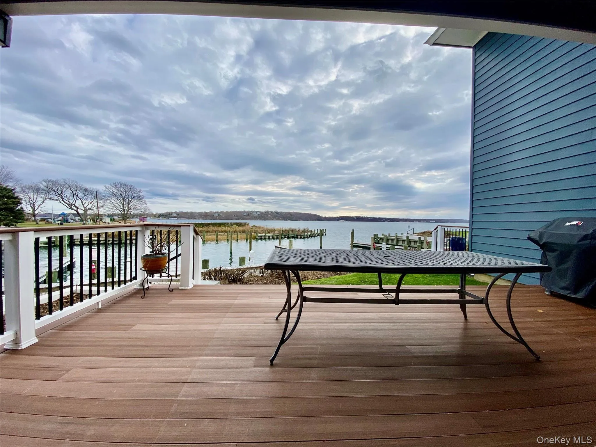 Deck with a water view and grilling area Deck with a water view and grilling area