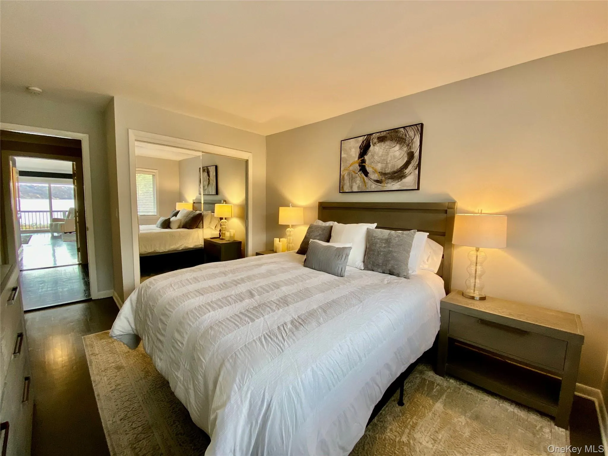 Bedroom with a closet and wood finished floors Bedroom with a closet and wood finished floors