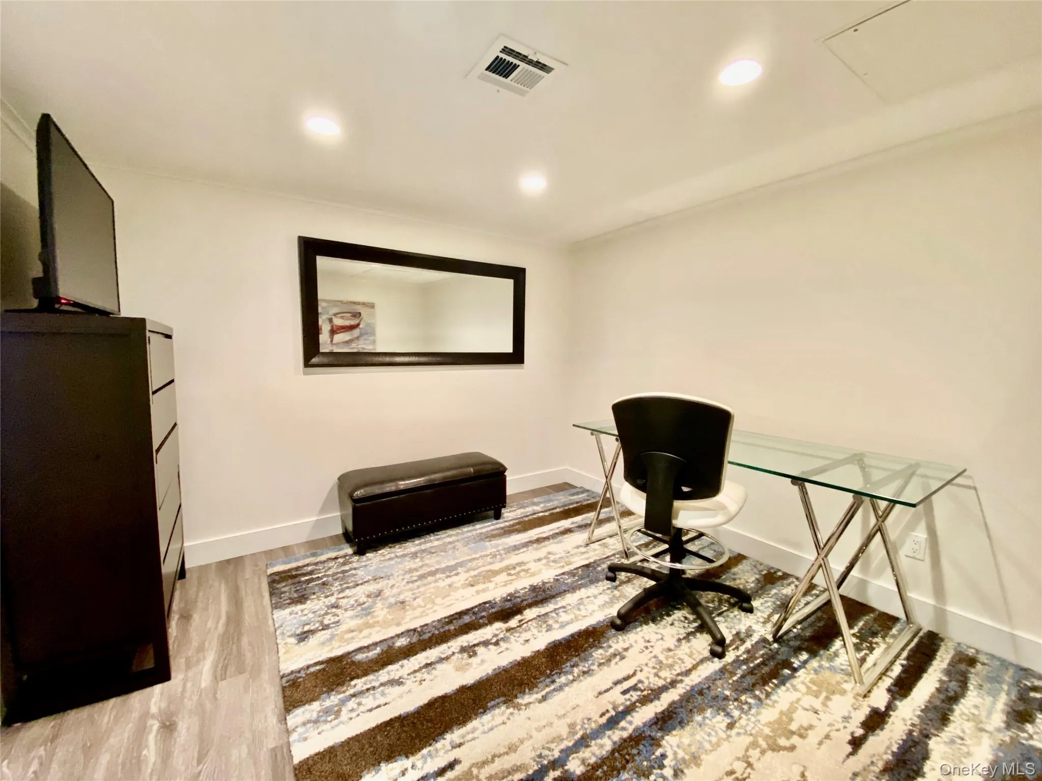 Office area featuring recessed lighting, light wood-style flooring, and attic access Office area featuring recessed lighting, light wood-style flooring, and attic access