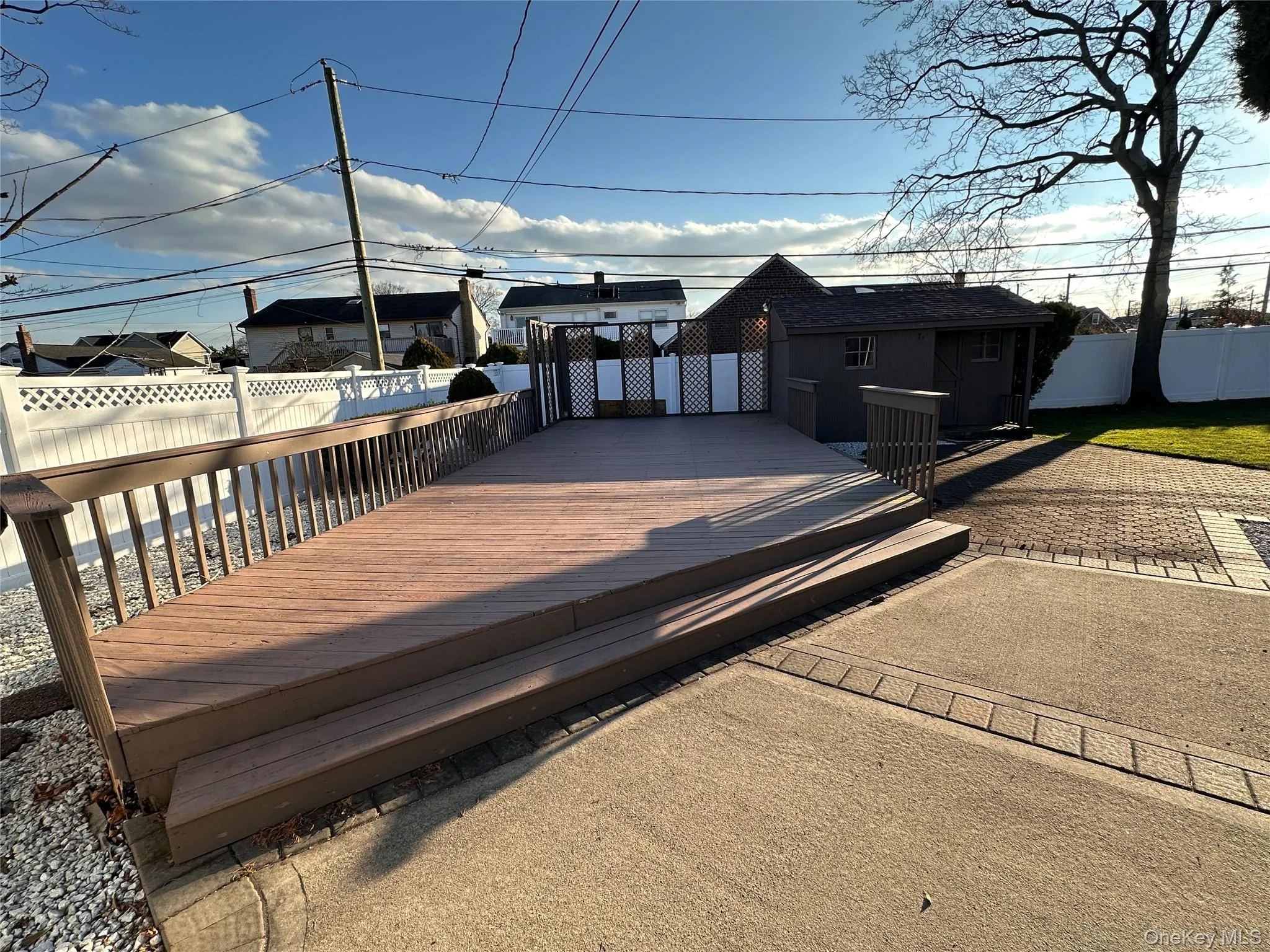 Wooden deck with a fenced backyard Wooden deck with a fenced backyard