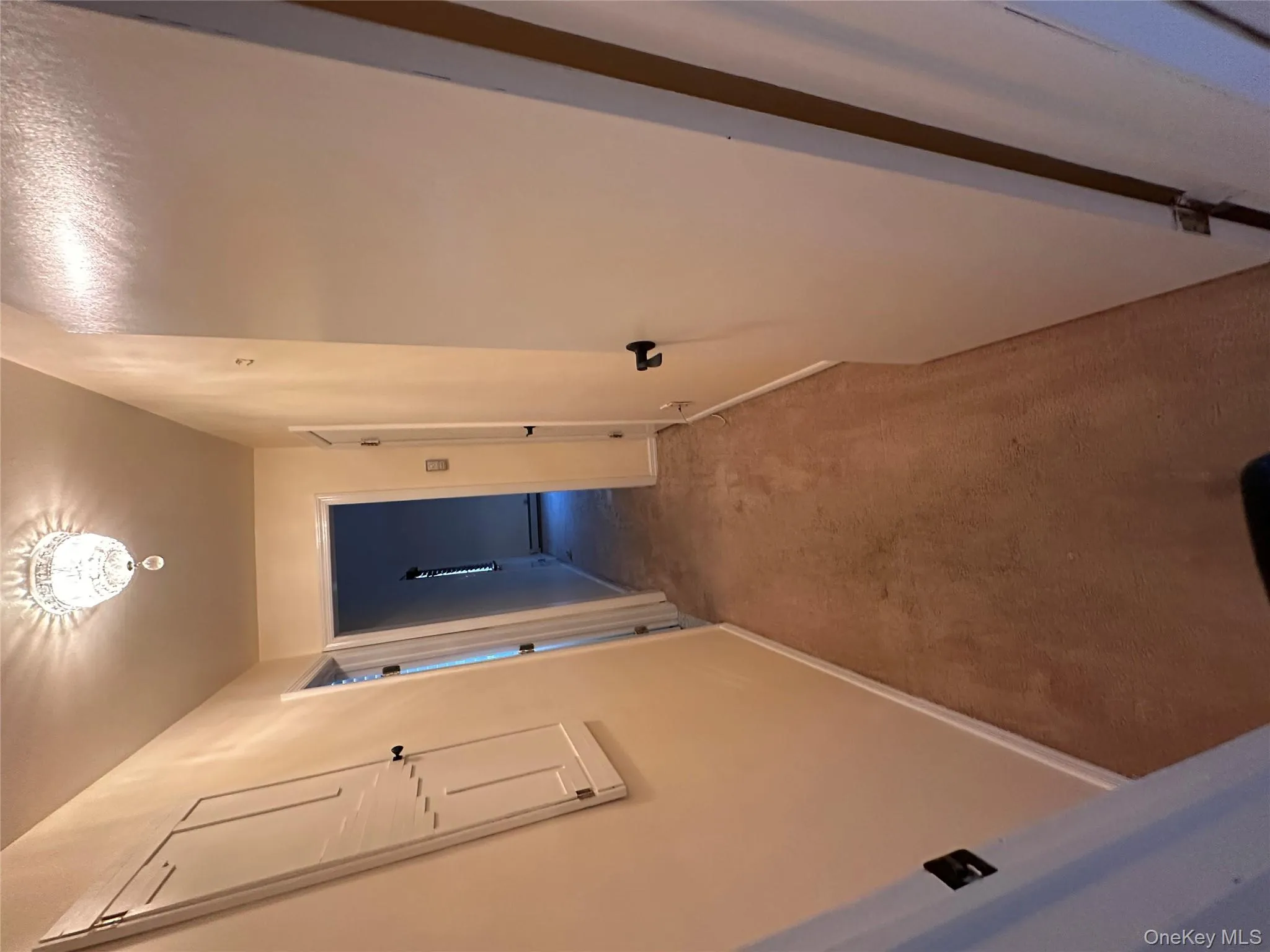 Hallway with carpet flooring and baseboards Hallway with carpet flooring and baseboards