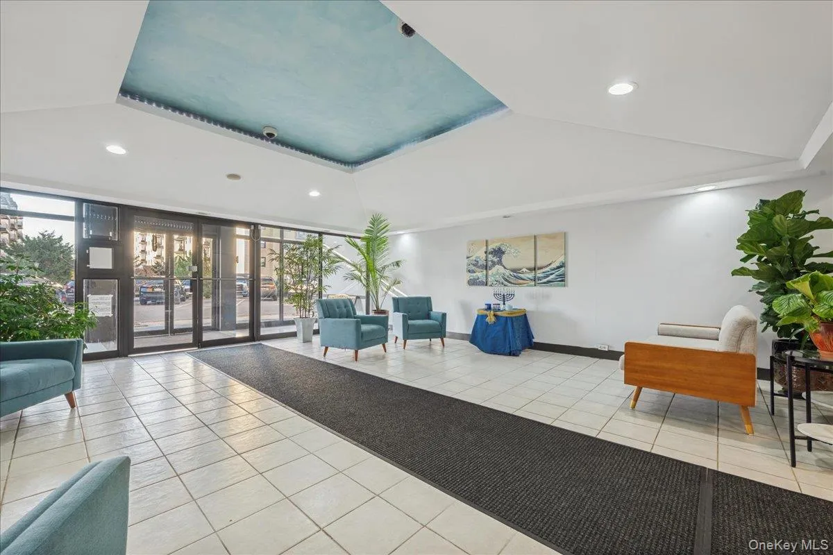 Common area featuring recessed lighting and a wall of windows Common area featuring recessed lighting and a wall of windows
