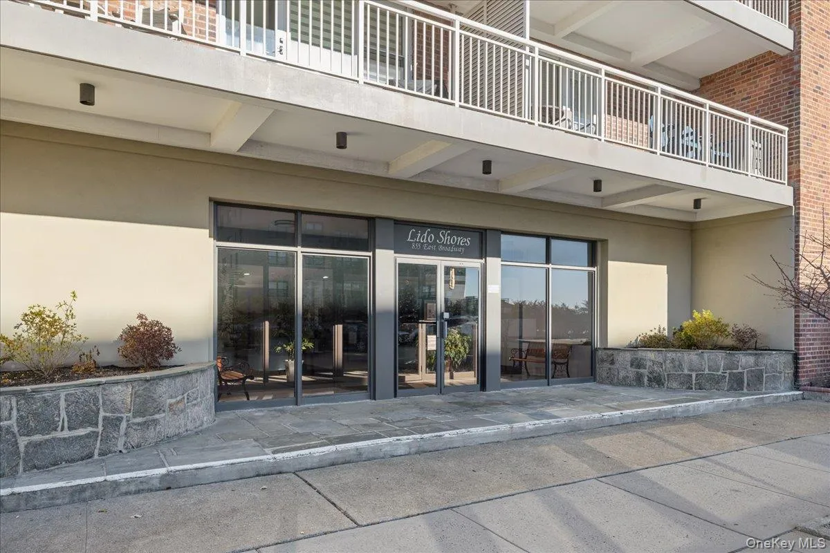 Property entrance with stucco siding Property entrance with stucco siding