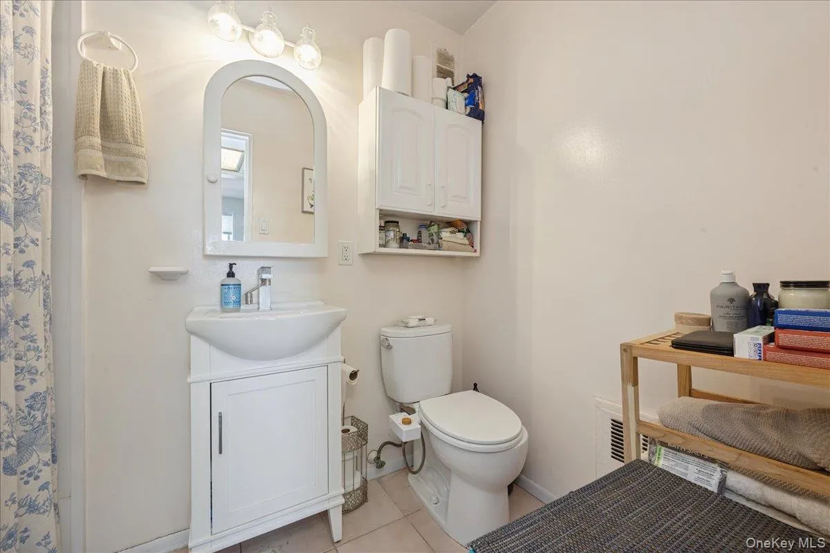 Bathroom featuring a shower with tub Bathroom featuring a shower with tub