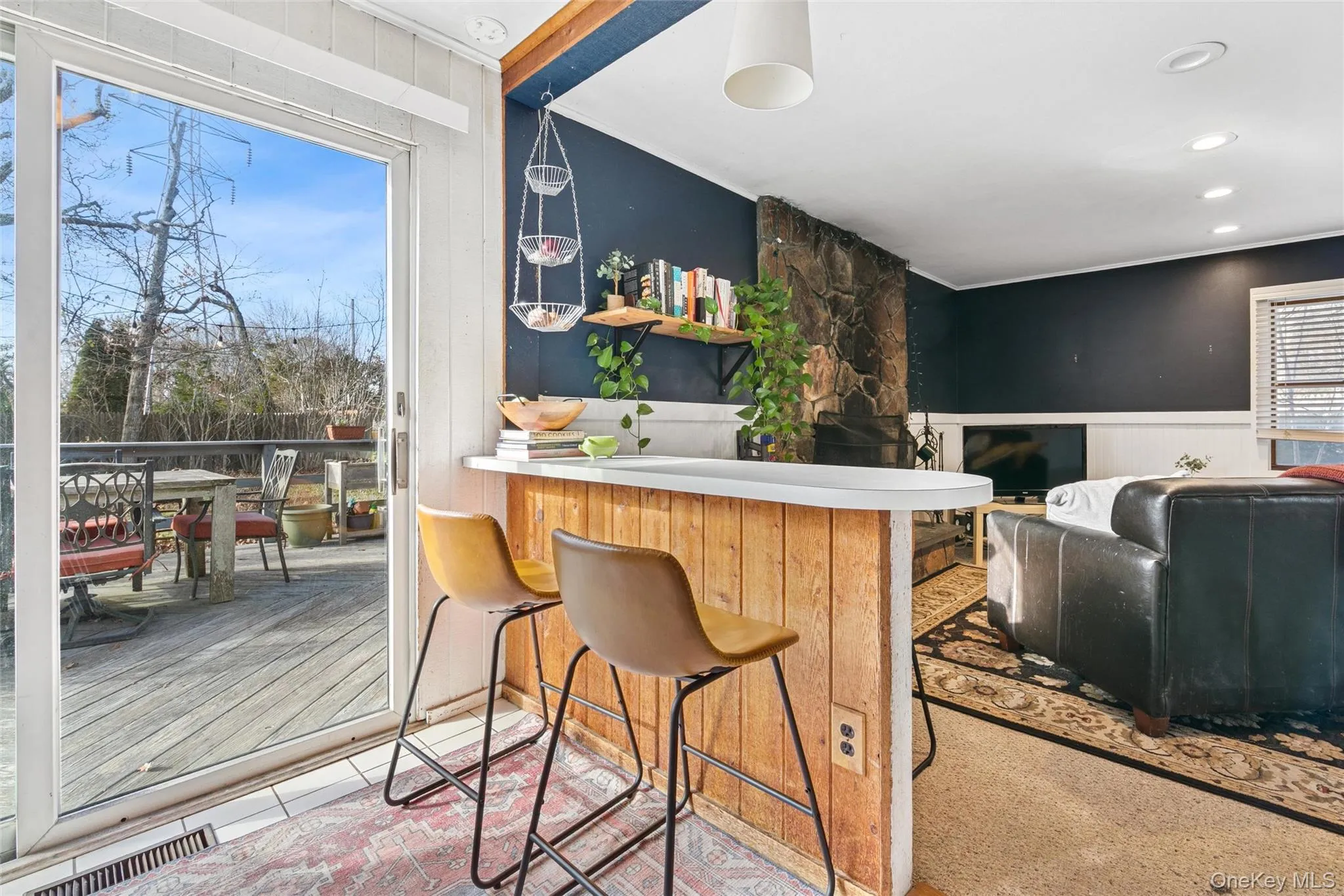 Bar area with light countertops and wainscoting Bar area with light countertops and wainscoting