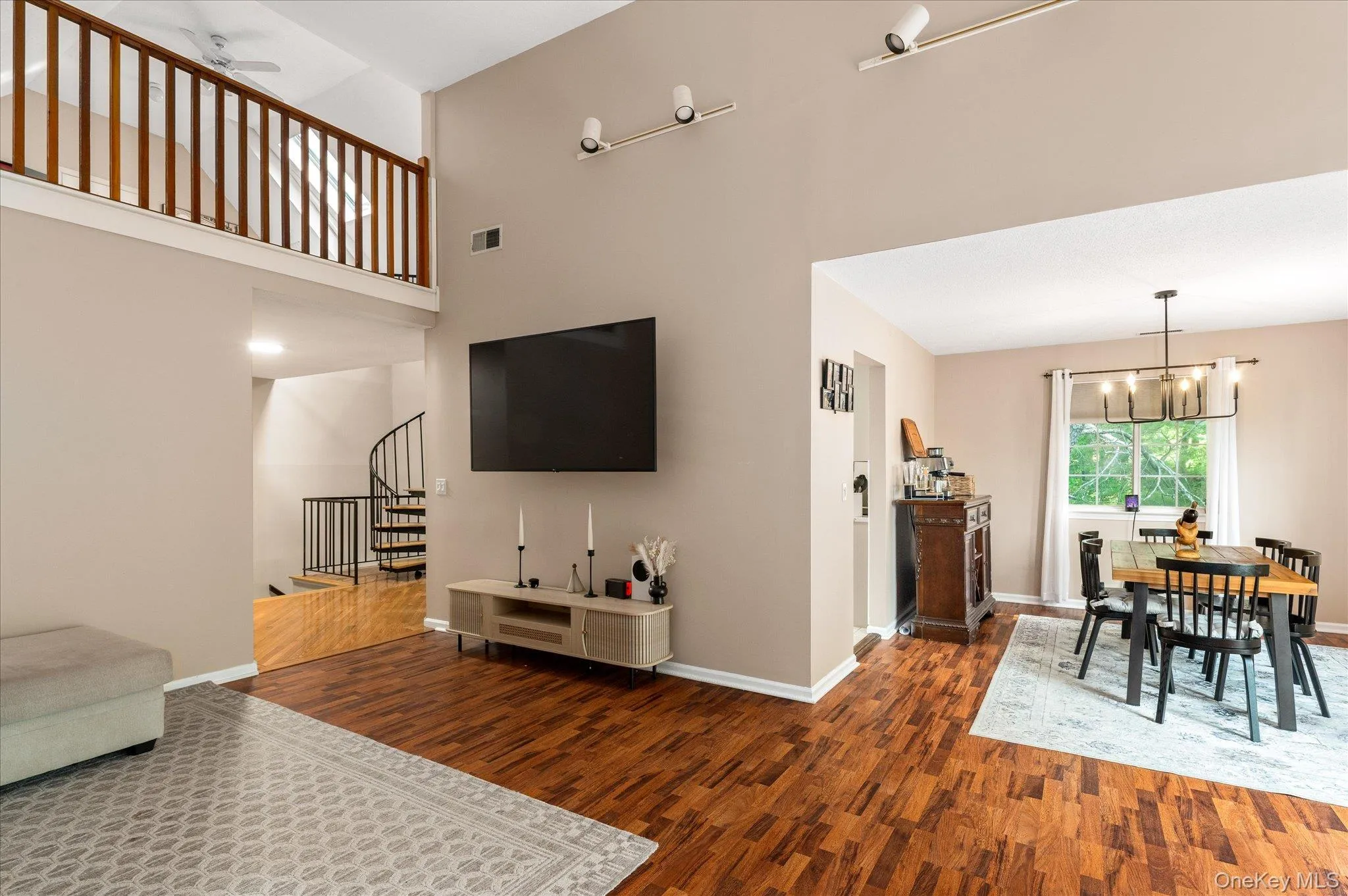 Living Room to Dining Room with View of Loft Space Living Room to Dining Room with View of Loft Space
