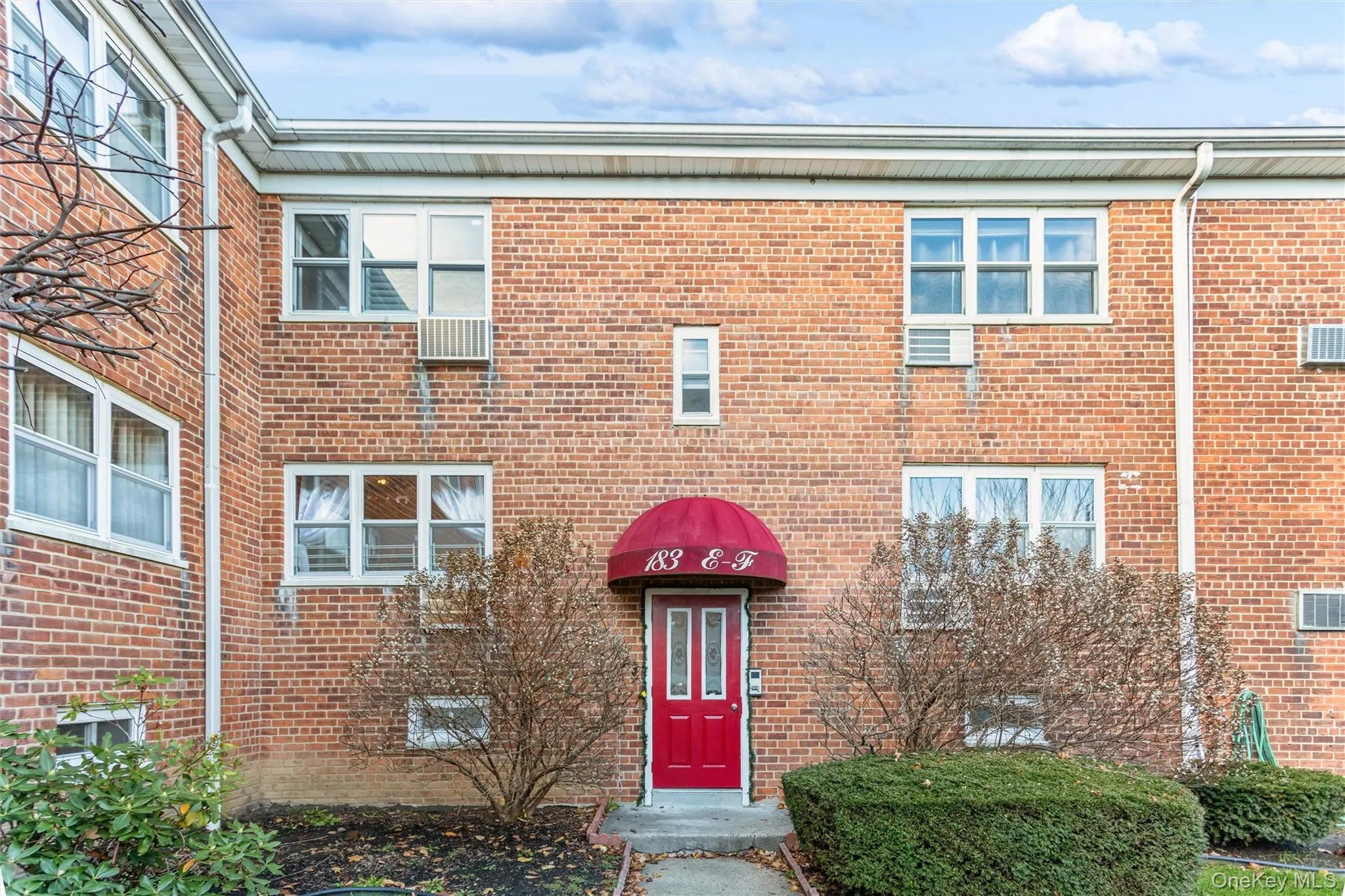 Property entrance with brick siding Property entrance with brick siding