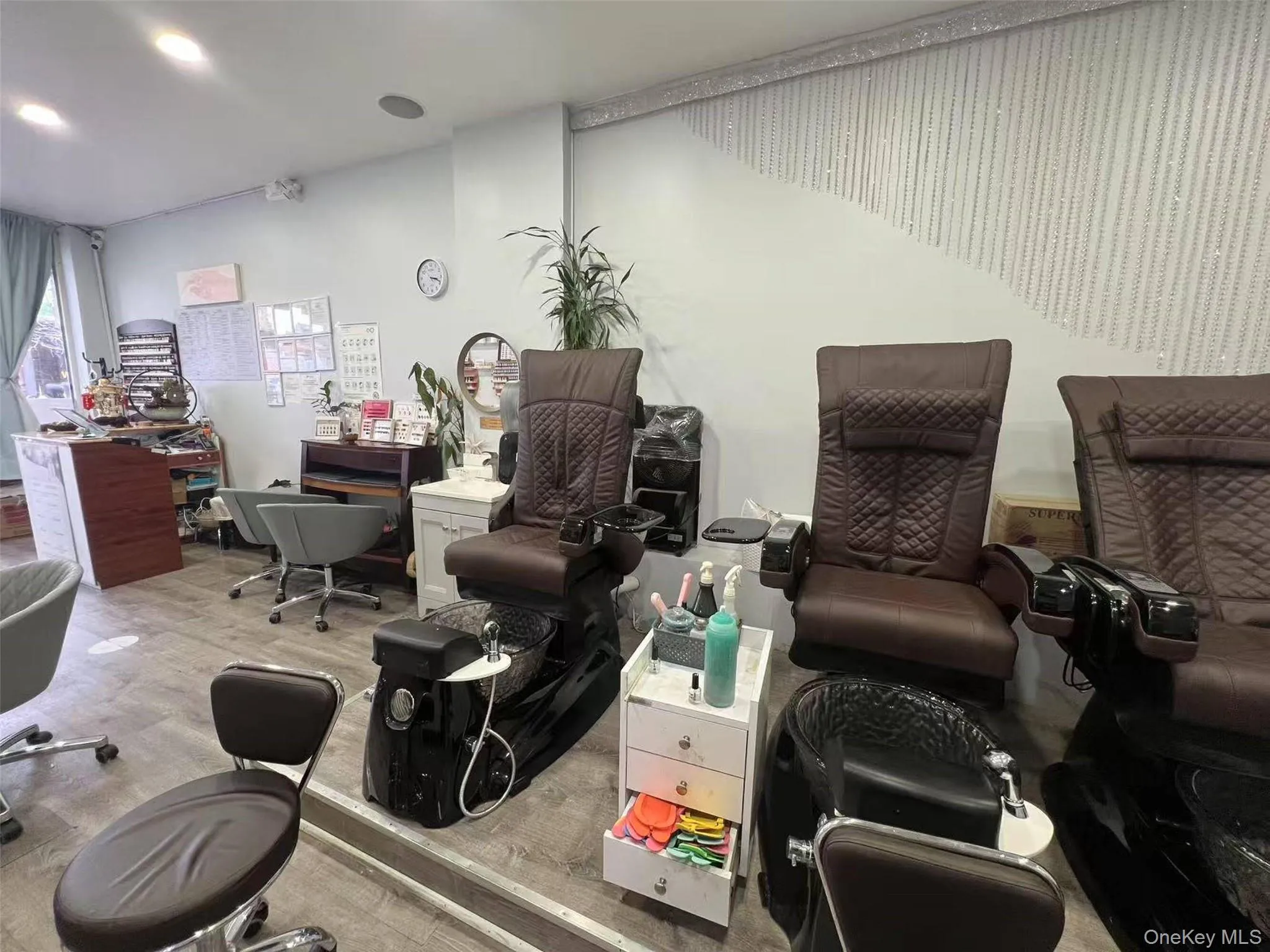 Misc room featuring wood finished floors and an office area Misc room featuring wood finished floors and an office area