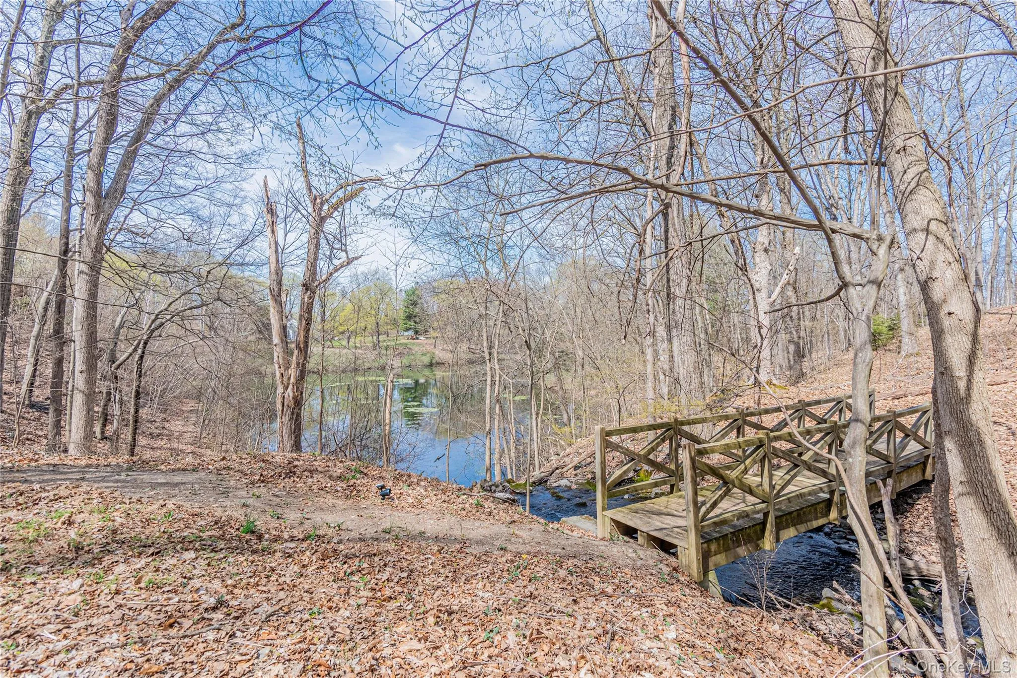 Dock with a water view and a forest view Dock with a water view and a forest view