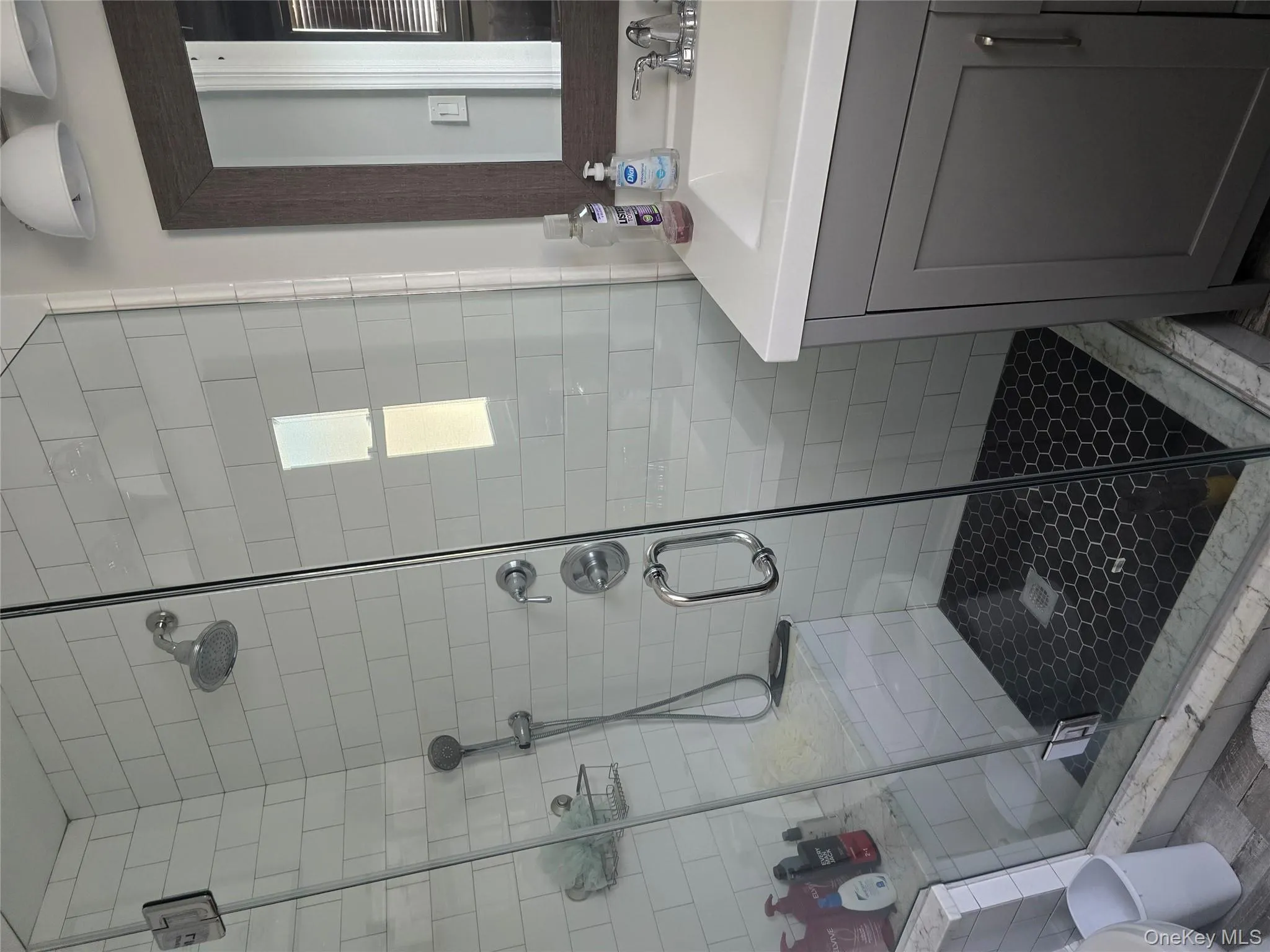 Full bath with a stall shower and vanity Full bath with a stall shower and vanity