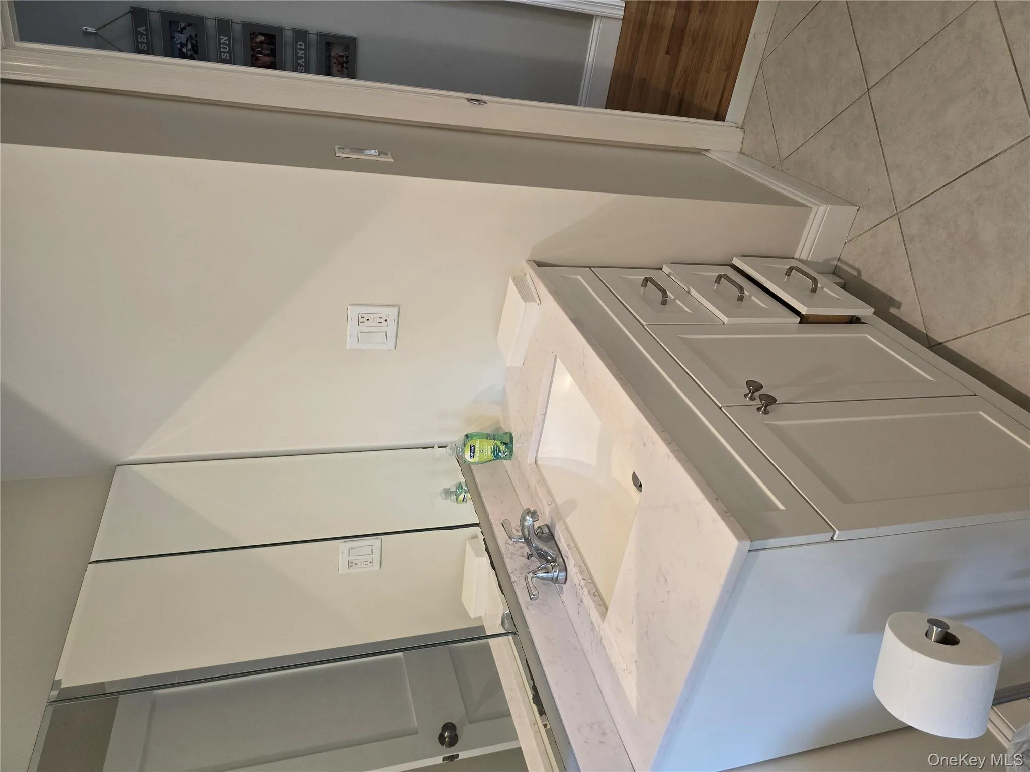 Bathroom with vanity and light tile patterned floors Bathroom with vanity and light tile patterned floors