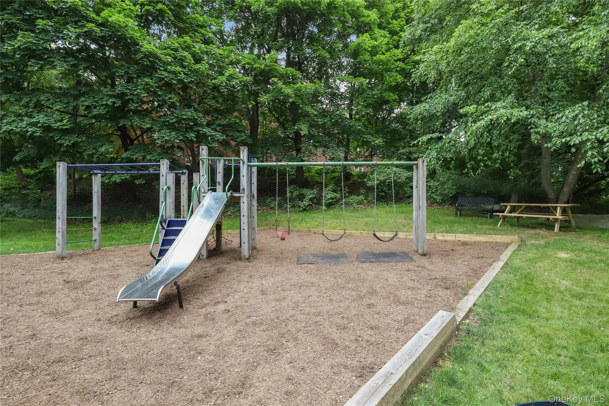 Community play area with a lawn Community play area with a lawn