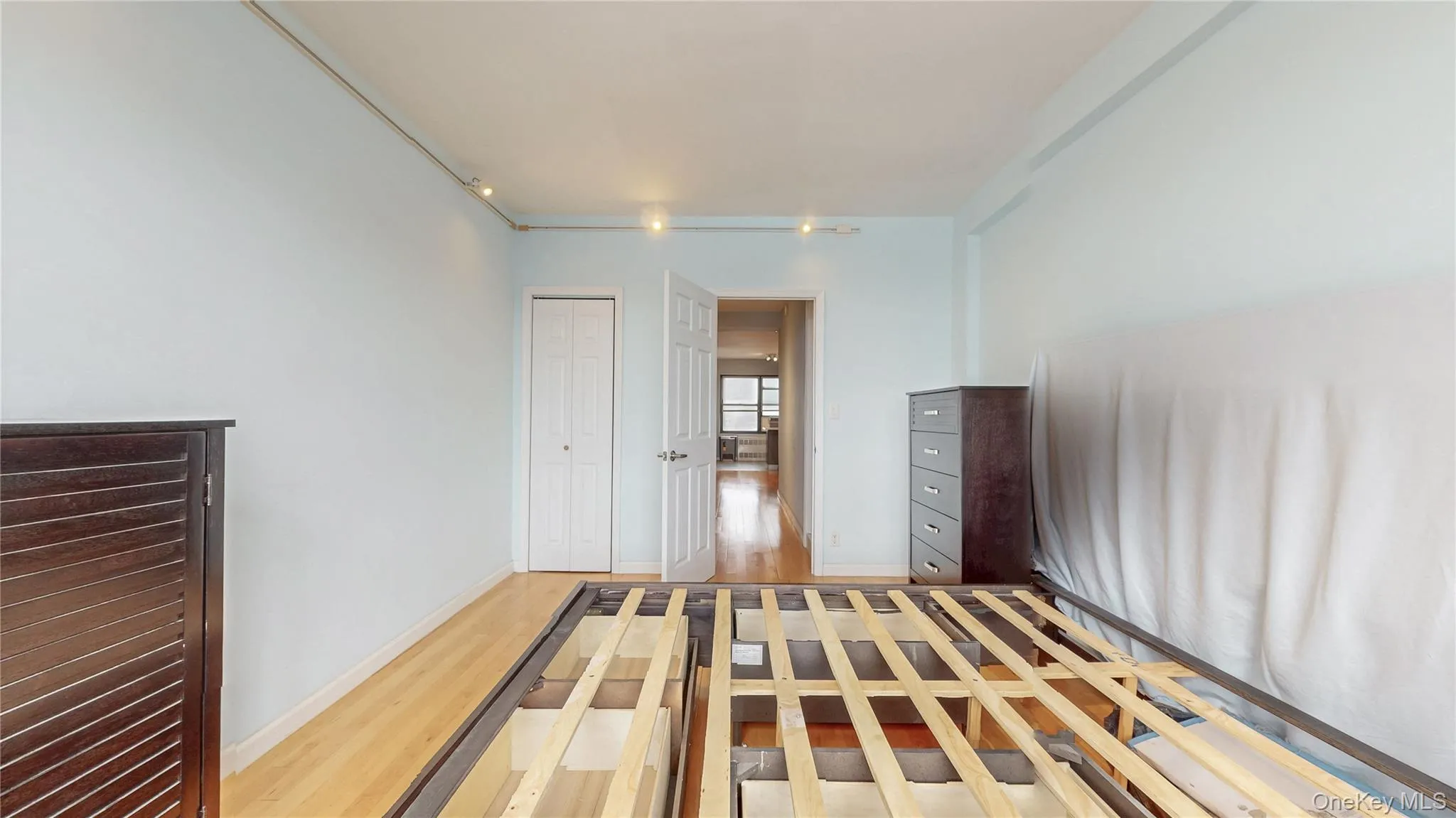 Bedroom with light wood-style floors and a closet Bedroom with light wood-style floors and a closet
