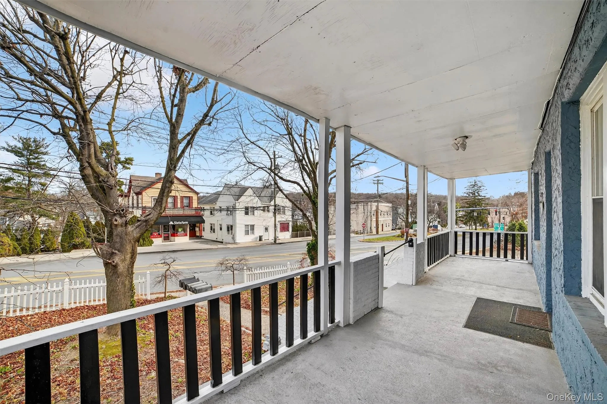 Covered porch featuring a residential view Covered porch featuring a residential view