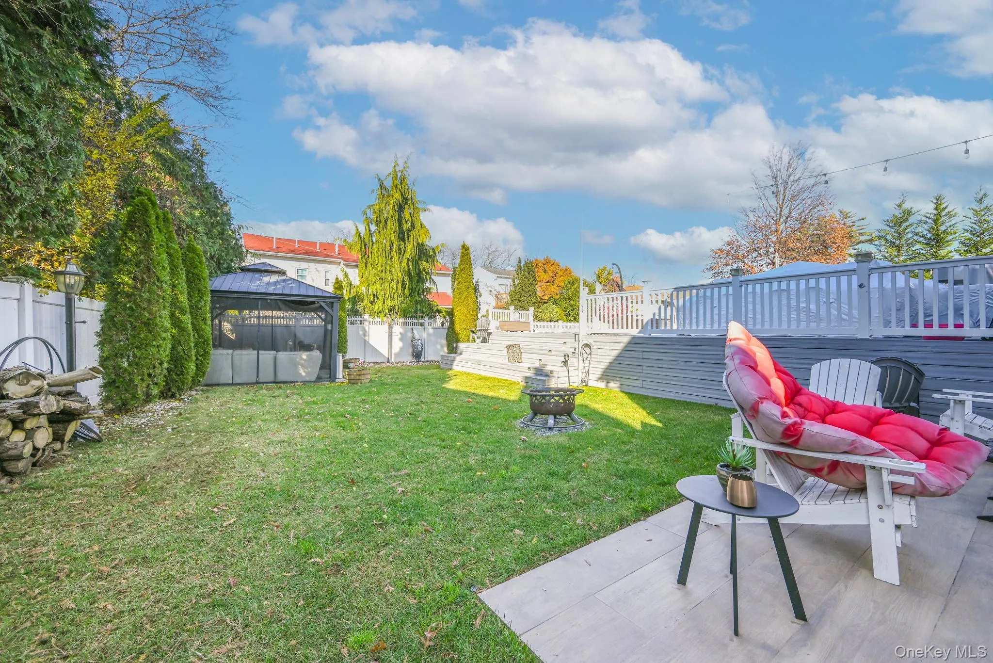 View of yard featuring a patio, a gazebo, and a fire pit View of yard featuring a patio, a gazebo, and a fire pit