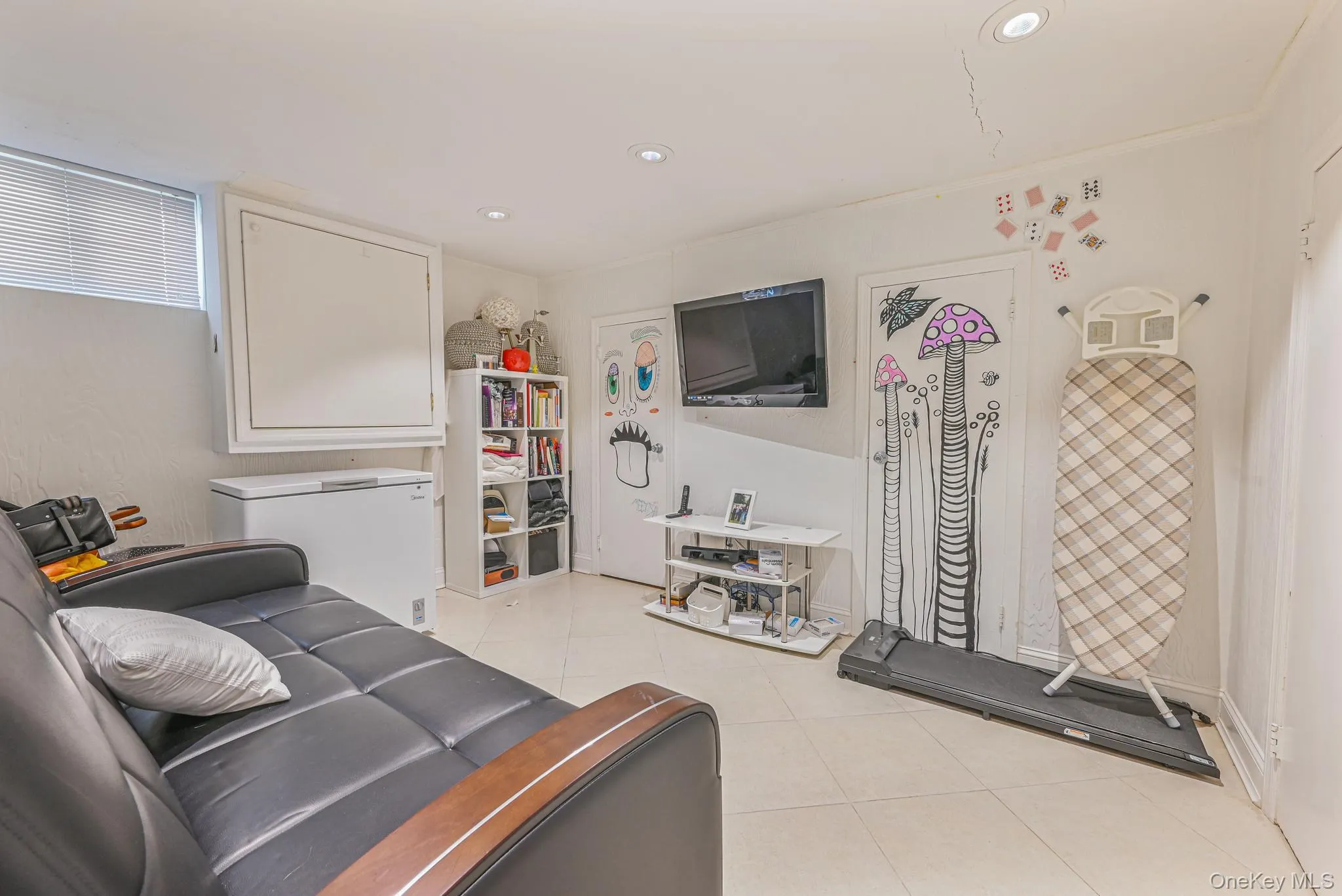 Living area with recessed lighting and light tile patterned floors Living area with recessed lighting and light tile patterned floors