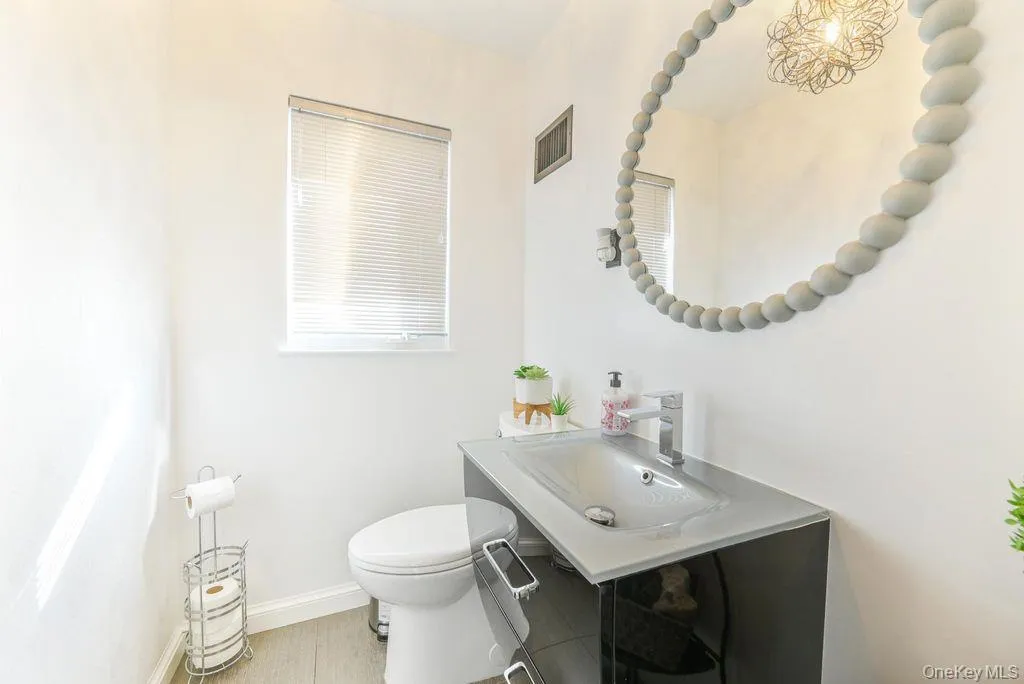 Bathroom with baseboards and vanity Bathroom with baseboards and vanity