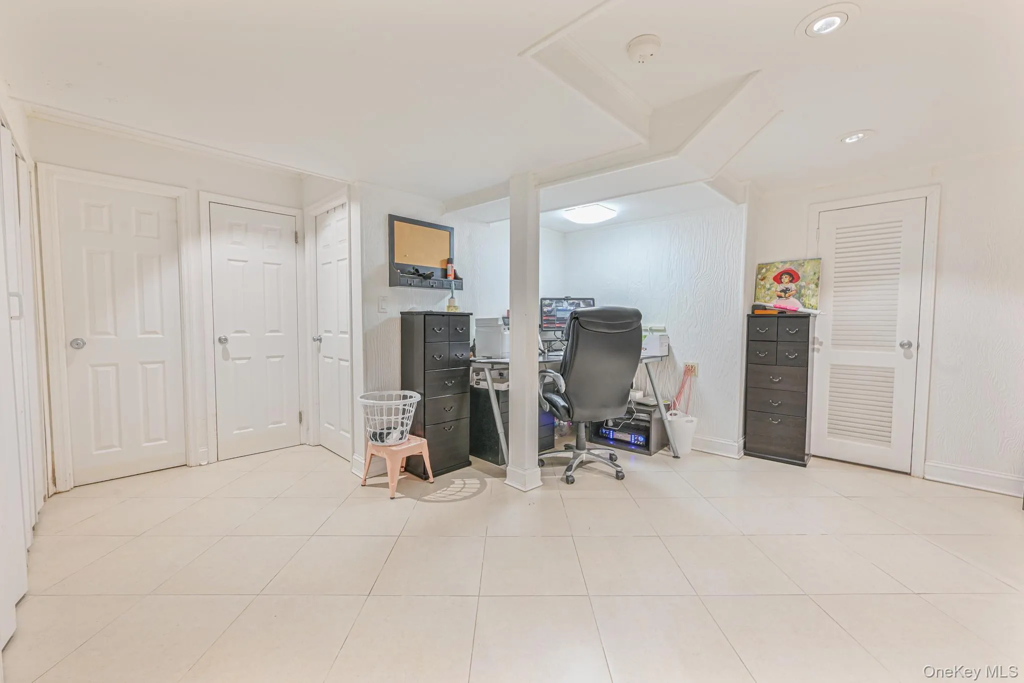 Office with baseboards and light tile patterned flooring Office with baseboards and light tile patterned flooring