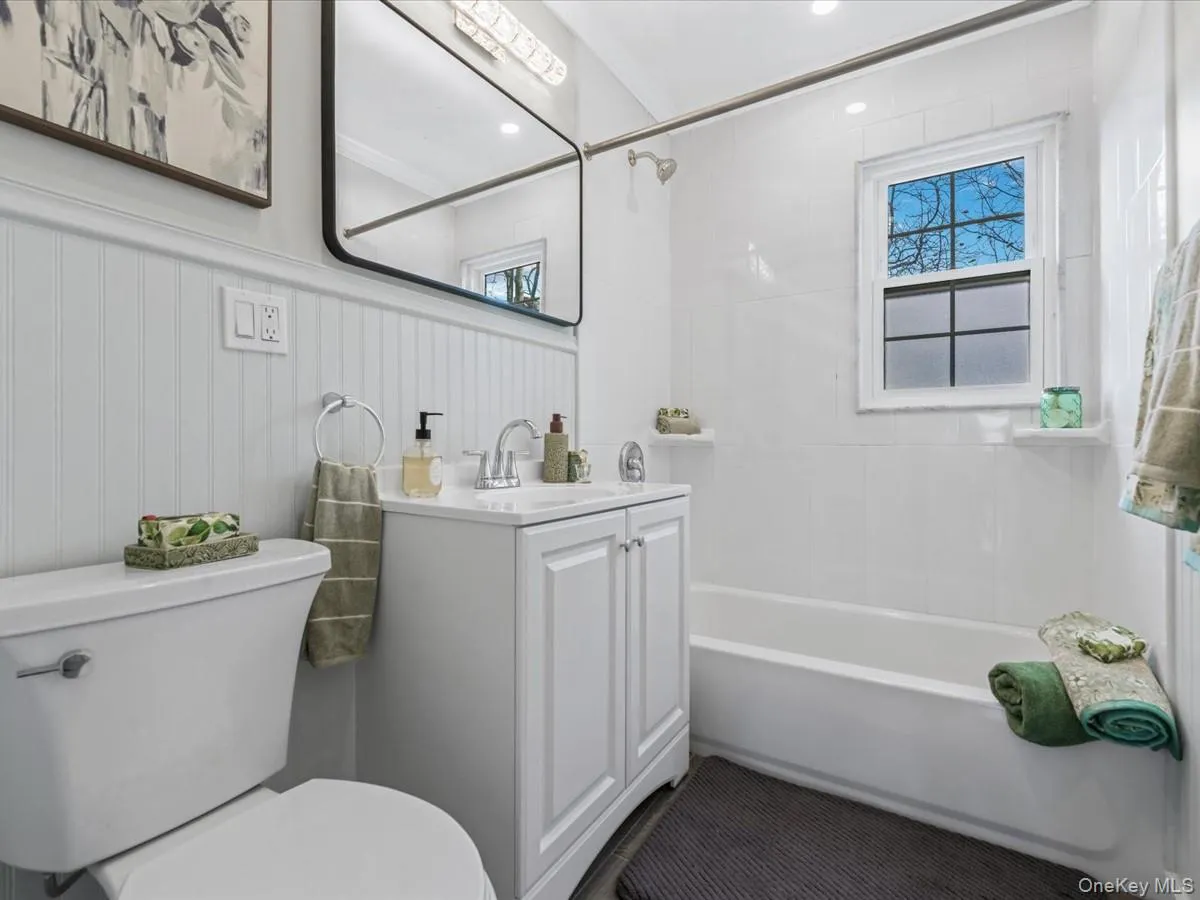 Full bathroom featuring vanity and shower / bathtub combination Full bathroom featuring vanity and shower / bathtub combination