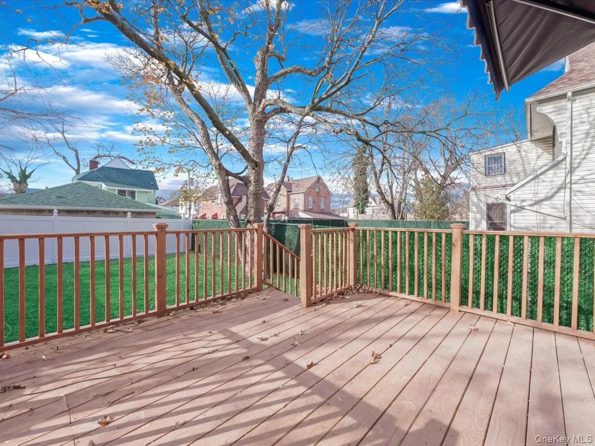 Deck featuring a residential view and a fenced backyard Deck featuring a residential view and a fenced backyard