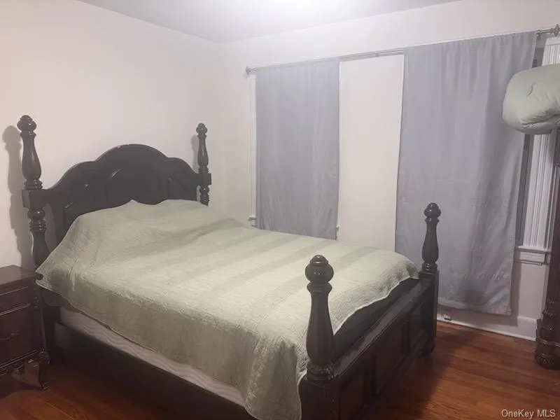 Bedroom featuring dark wood-type flooring Bedroom featuring dark wood-type flooring