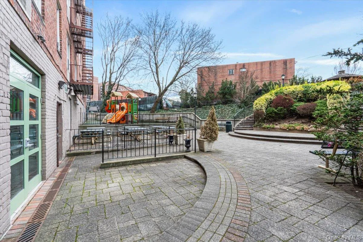 View of property's community featuring a patio area and stairway View of property's community featuring a patio area and stairway