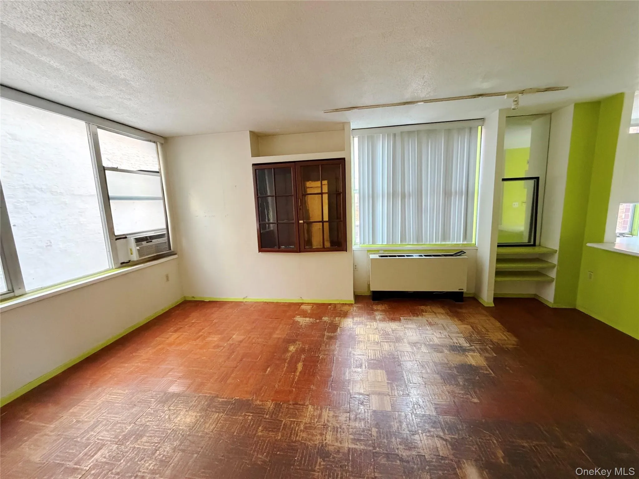 Unfurnished room with a textured ceiling Unfurnished room with a textured ceiling