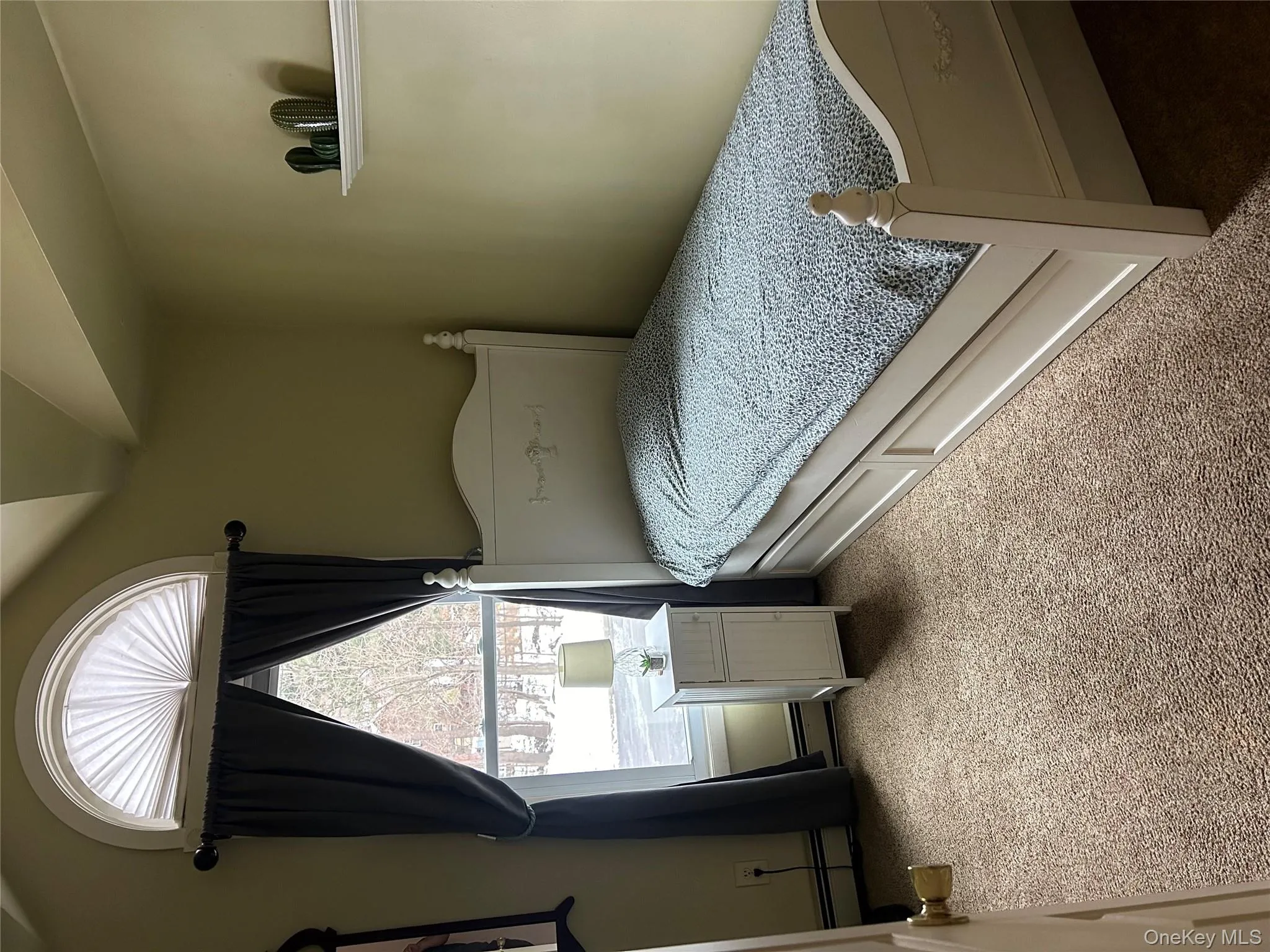 Bedroom featuring carpet floors and lofted ceiling Bedroom featuring carpet floors and lofted ceiling