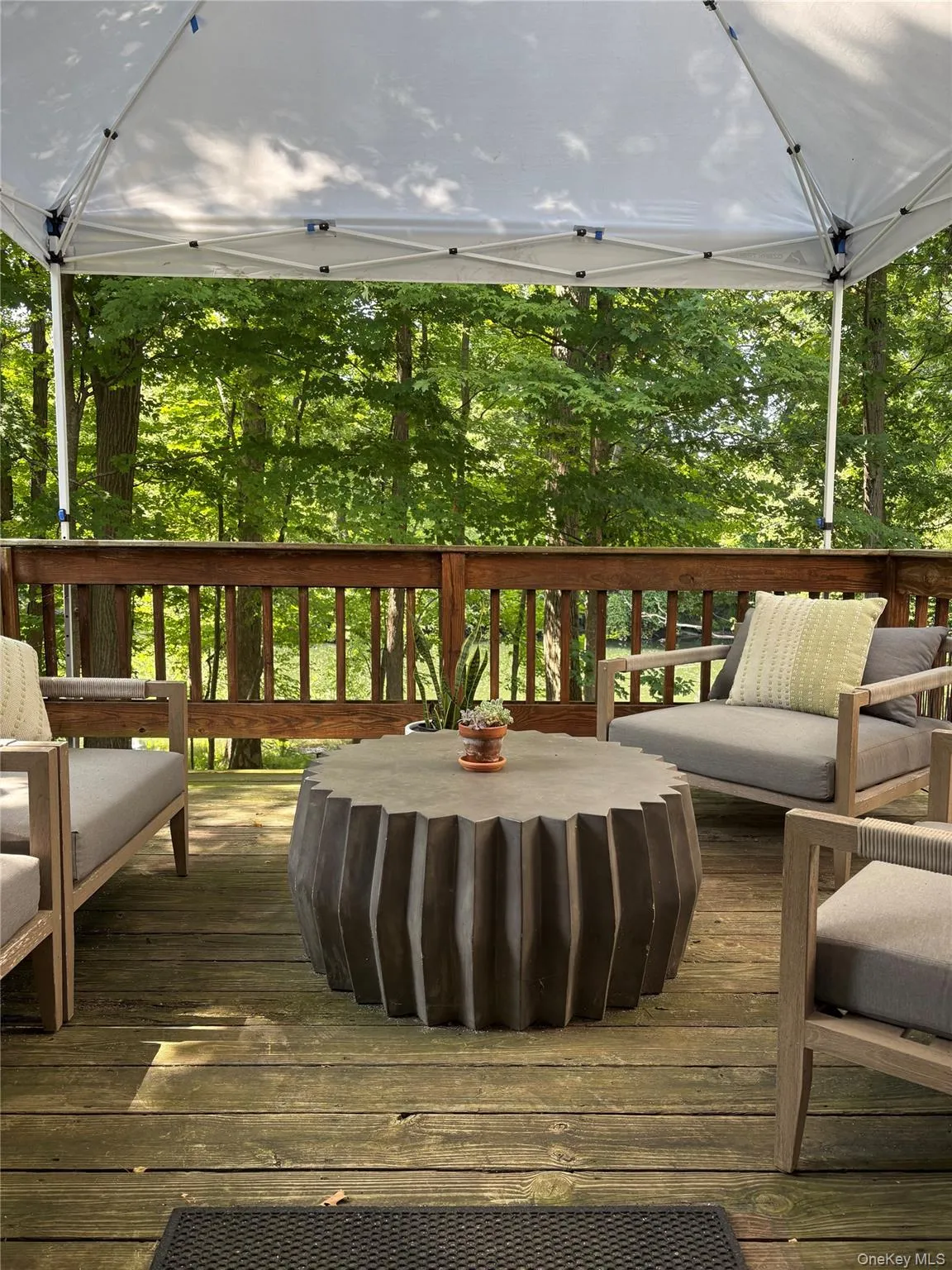 Deck featuring view of wooded area Deck featuring view of wooded area