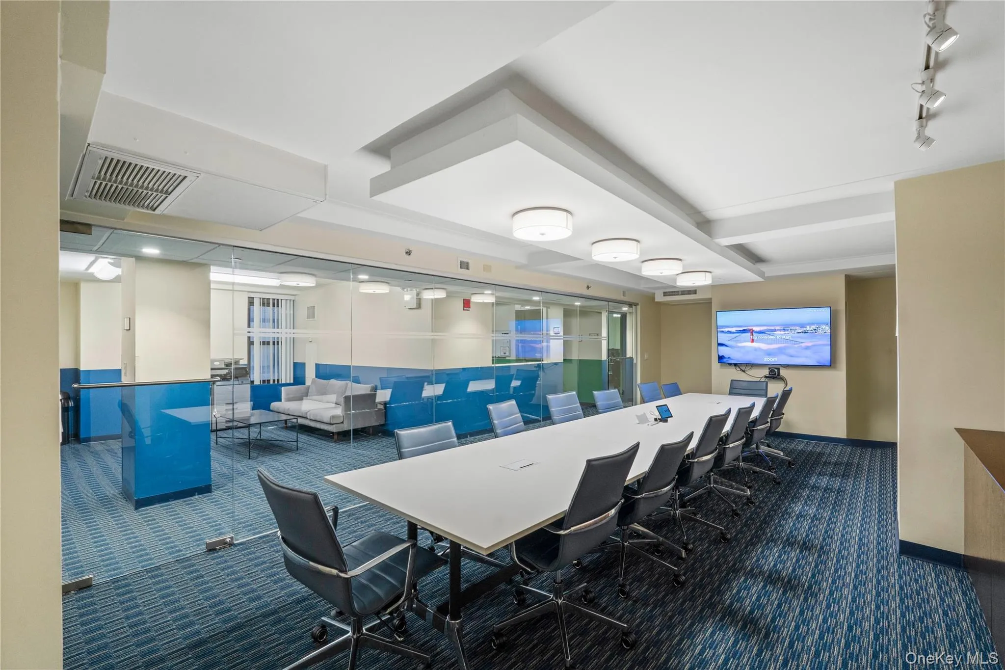 Conference Room with track lighting and dark colored carpet Conference Room with track lighting and dark colored carpet