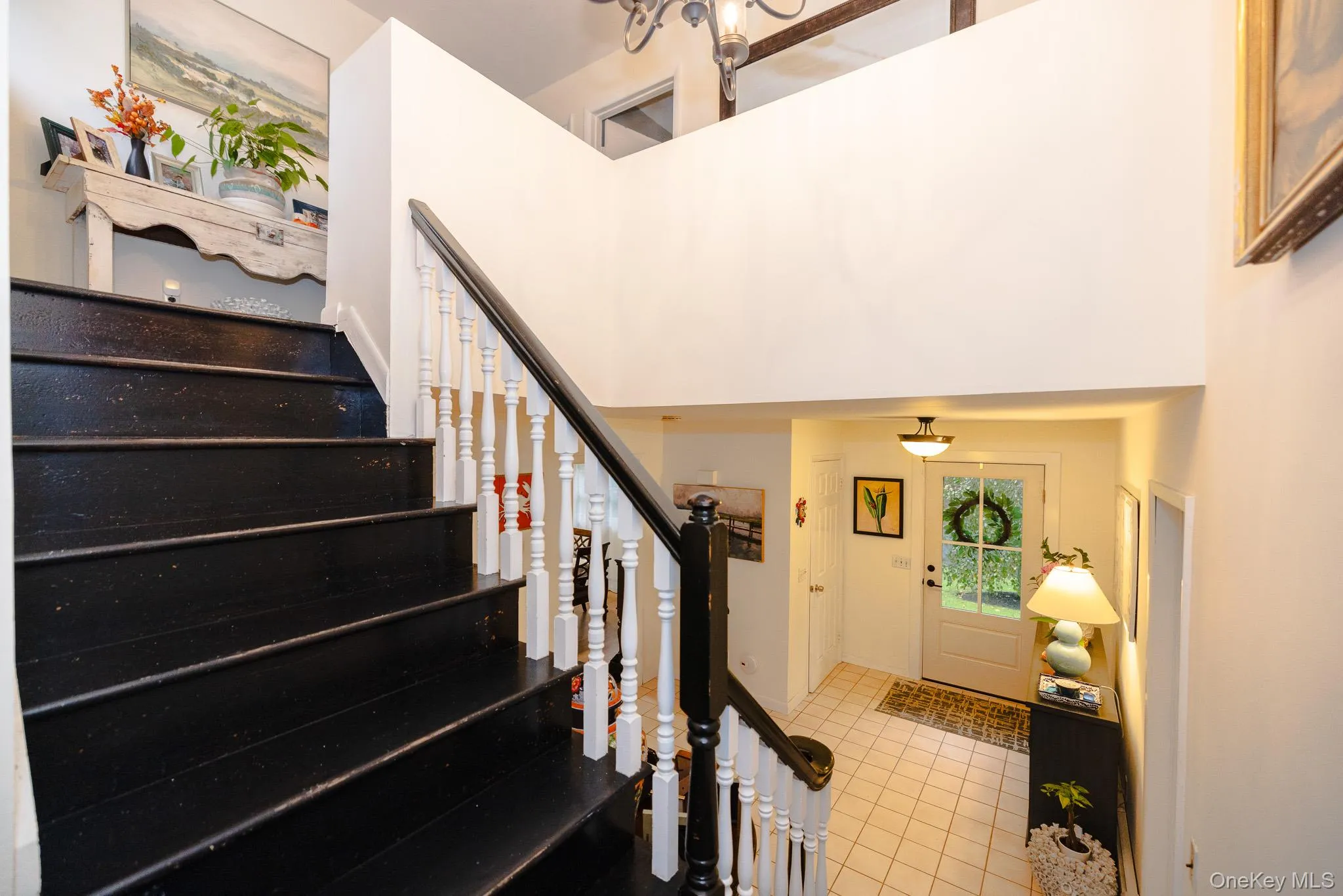 Stairway with a high ceiling and tile patterned floors Stairway with a high ceiling and tile patterned floors