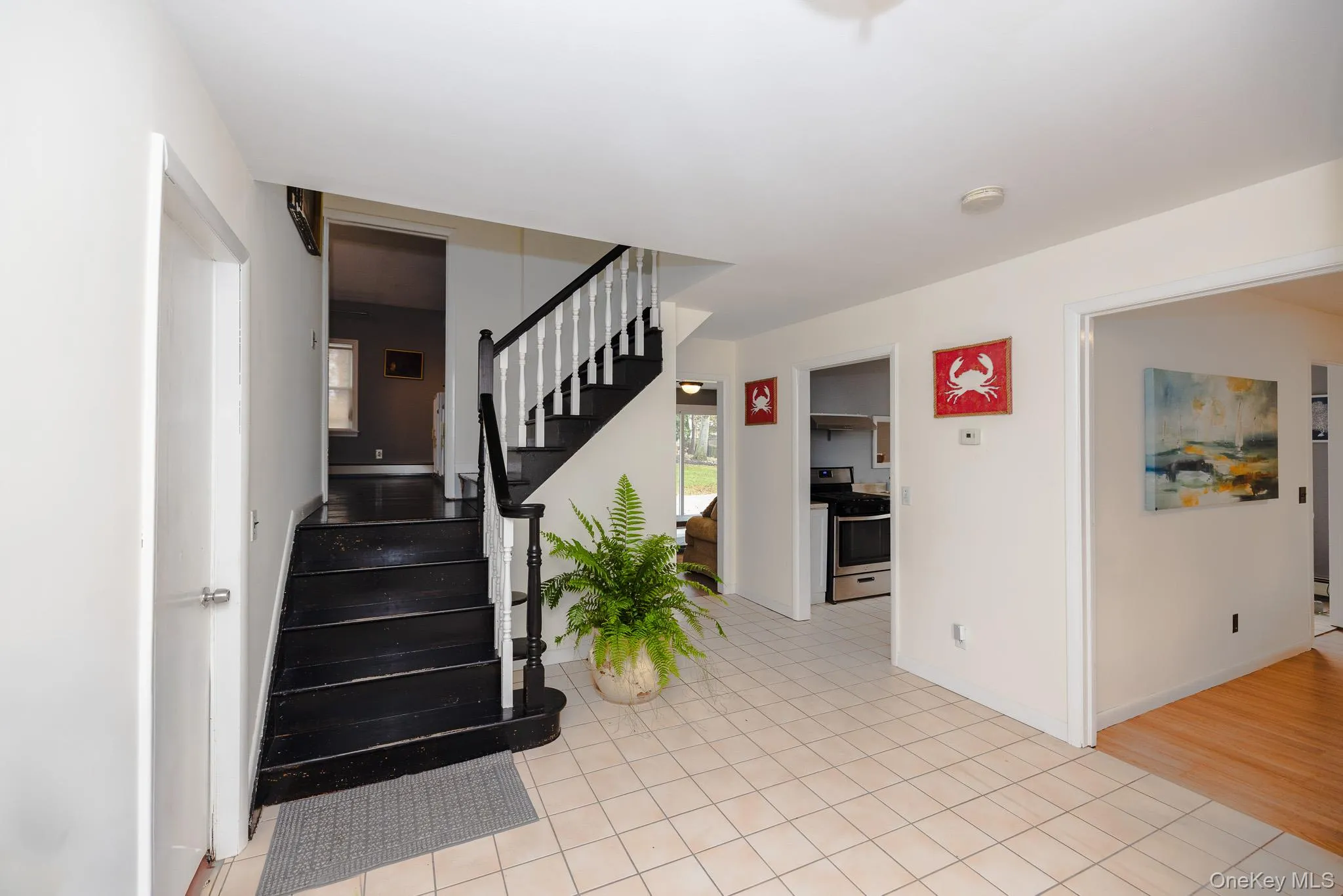Stairs featuring tile patterned floors Stairs featuring tile patterned floors