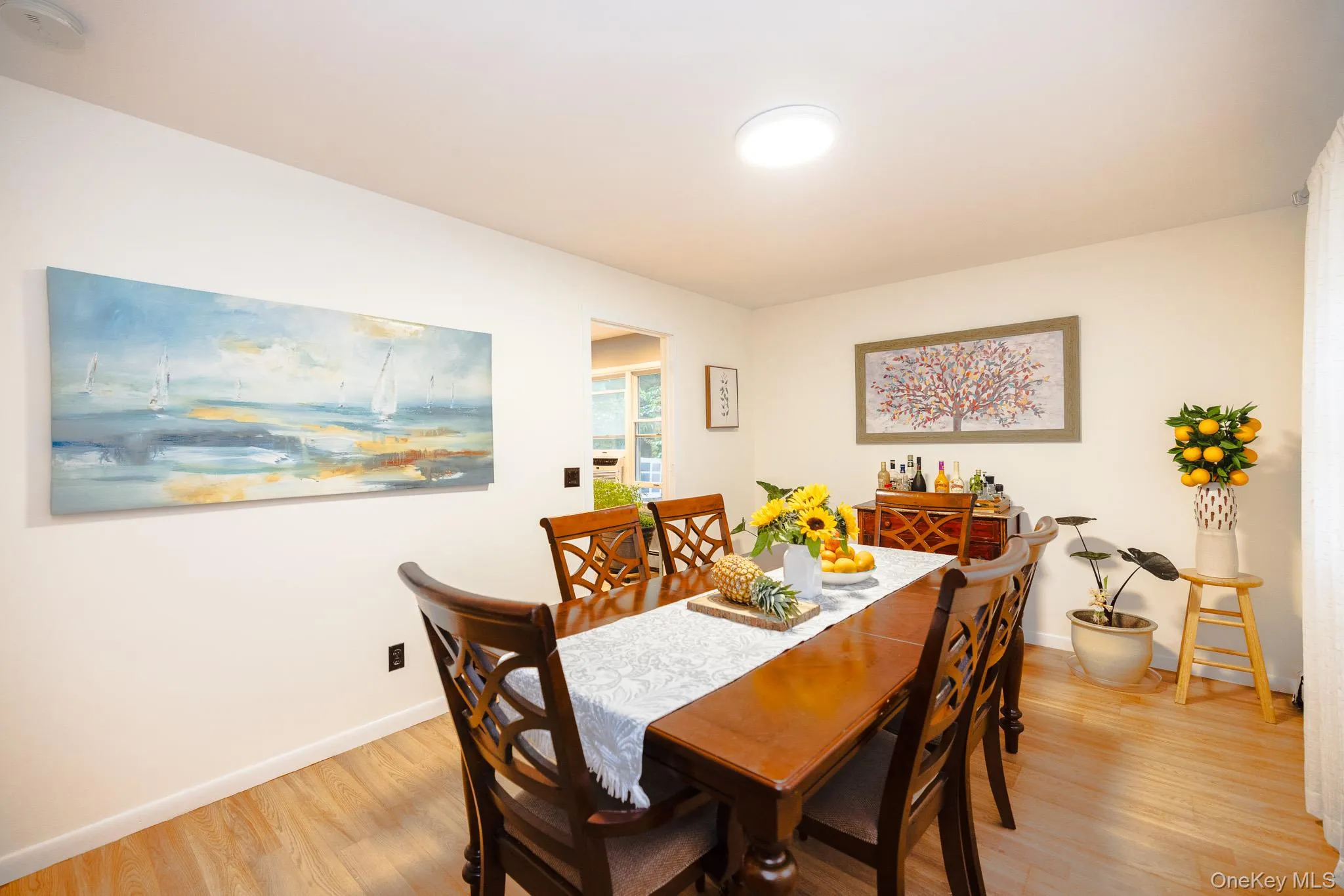 Dining room featuring light wood finished floors Dining room featuring light wood finished floors