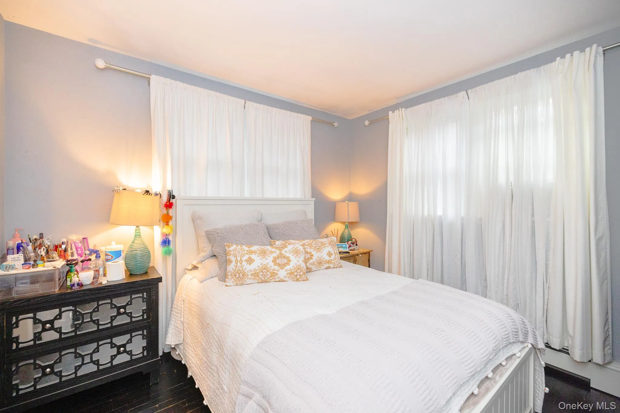 Bedroom featuring dark wood-style floors Bedroom featuring dark wood-style floors