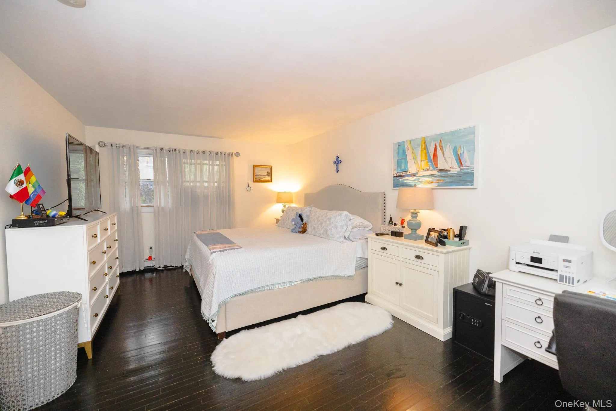 Bedroom with dark wood finished floors Bedroom with dark wood finished floors